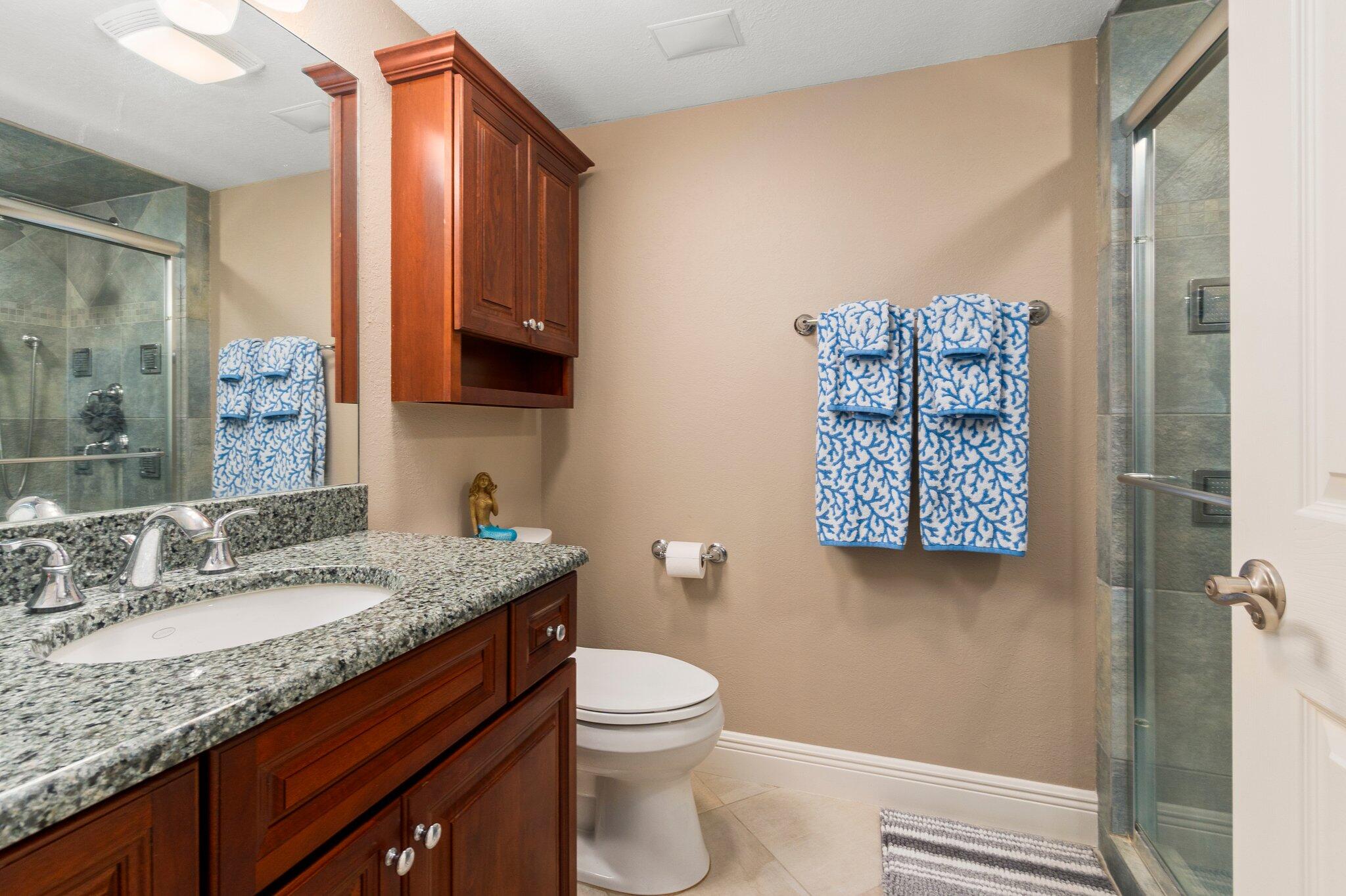 3100 North Hwy A1A, Unit PHA4 Fort Pierce, FL 34949 - Photo 34 of 54 a bathroom with a granite countertop sink toilet and shower