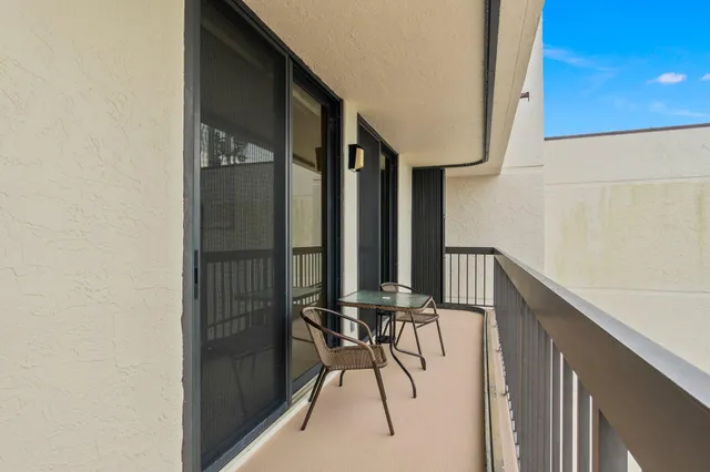 a view of a livingroom with furniture and a kitchen