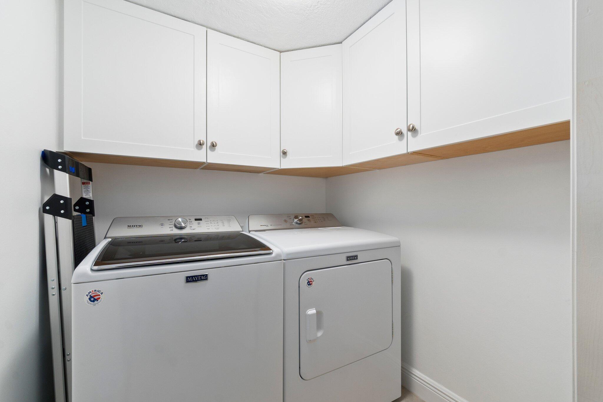 3100 North Hwy A1A, Unit PHA4 Fort Pierce, FL 34949 - Photo 40 of 54 a view of storage and utility room with washer and dryer