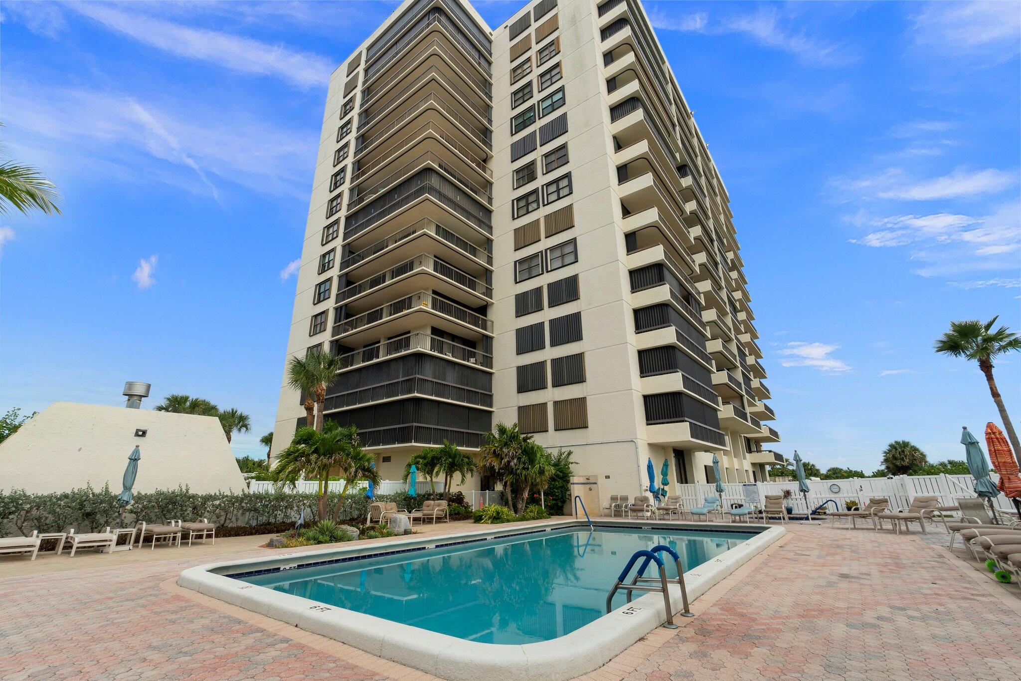 3100 North Hwy A1A, Unit PHA4 Fort Pierce, FL 34949 - Photo 44 of 54 a view of a tall building next to a road