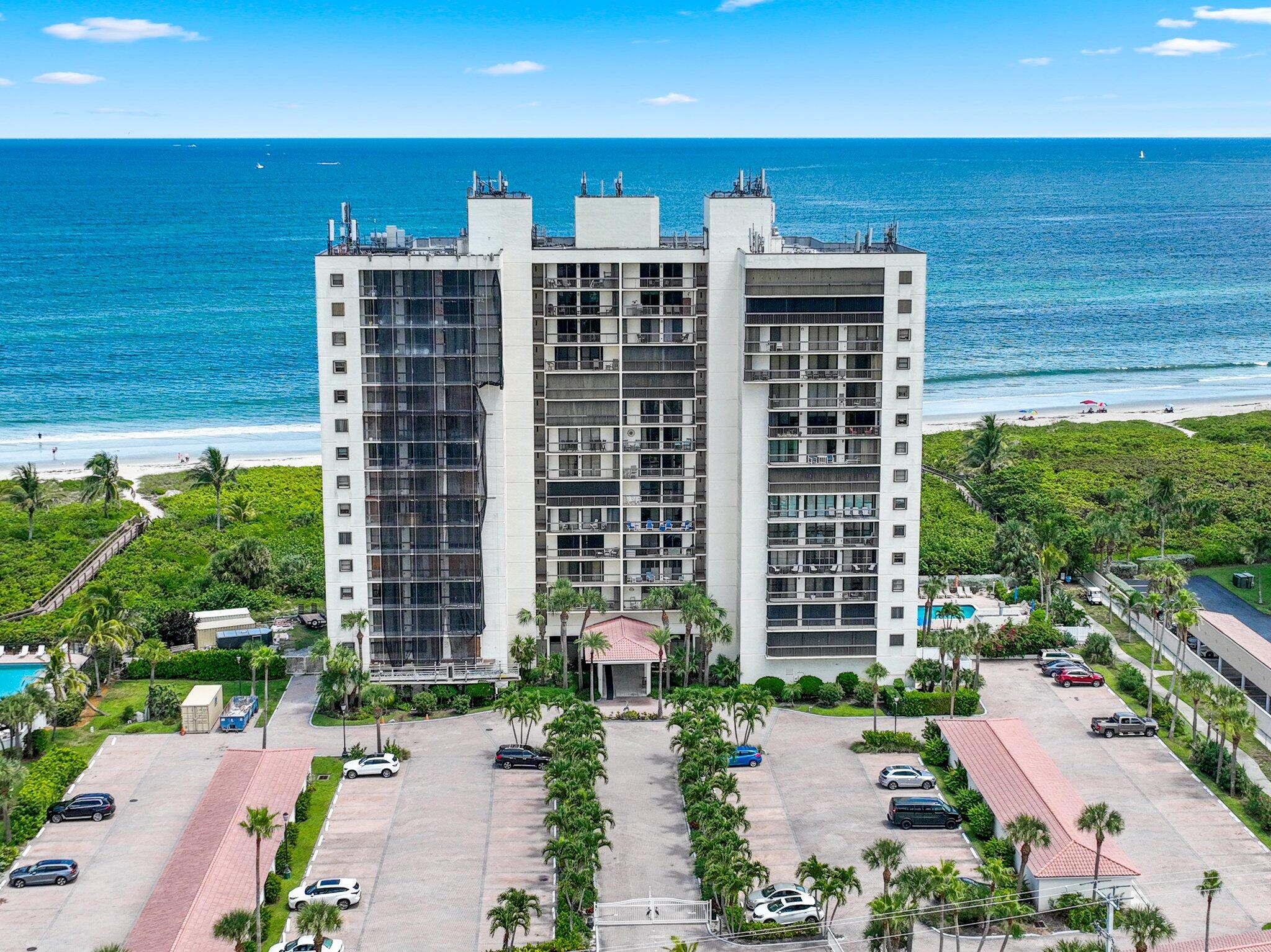3100 North Hwy A1A, Unit PHA4 Fort Pierce, FL 34949 - Photo 54 of 54 a front view of a building with a garden