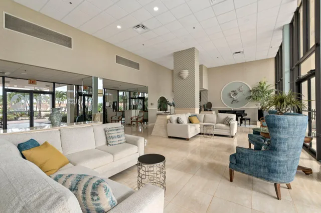 a very nice looking room with a dining table chairs and chandelier