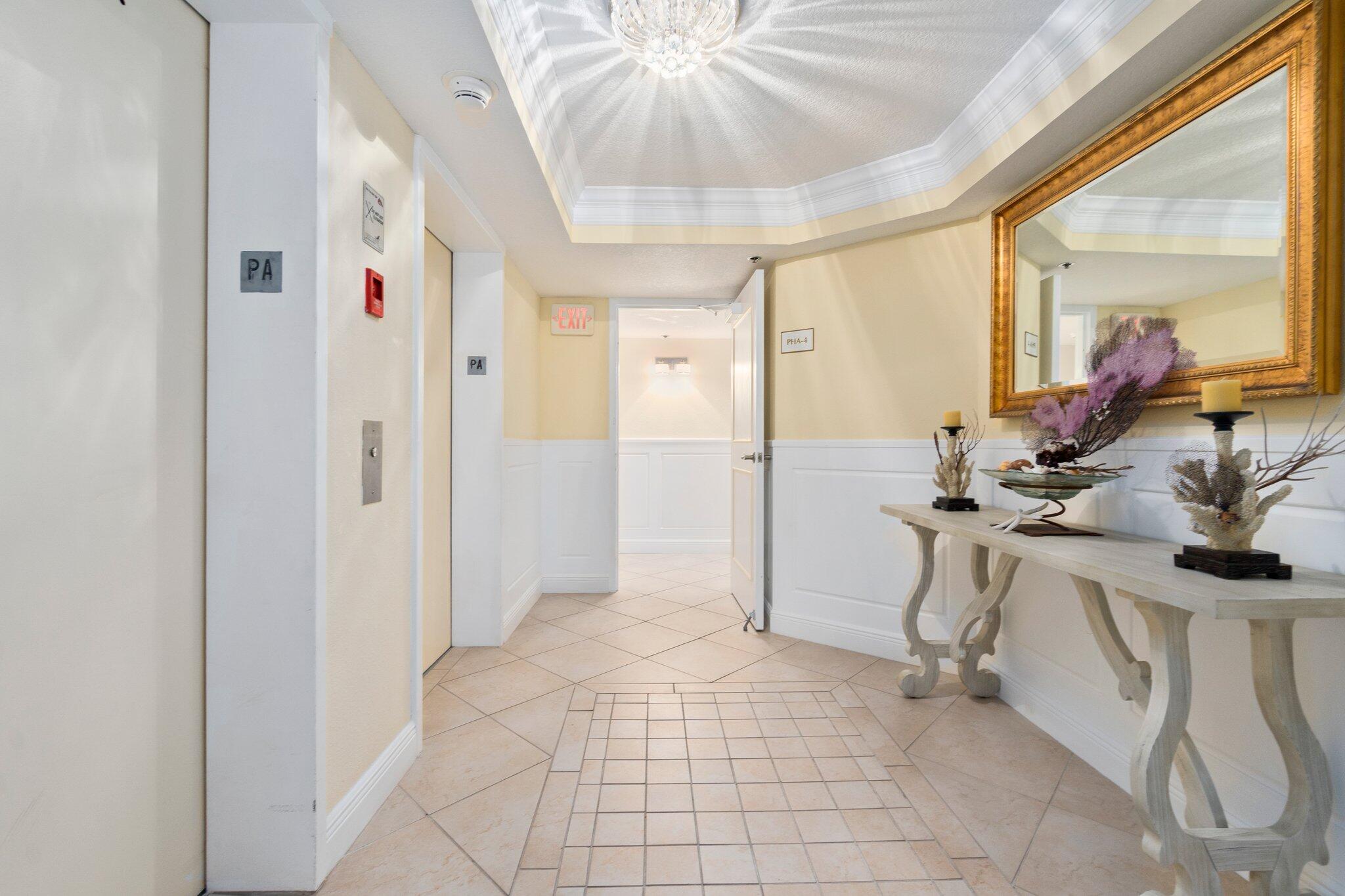 3100 North Hwy A1A, Unit PHA4 Fort Pierce, FL 34949 - Photo 7 of 54 a very nice looking room with a dining table chairs and chandelier