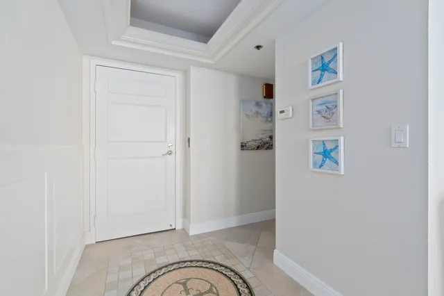 a living room with furniture a rug and a flat screen tv