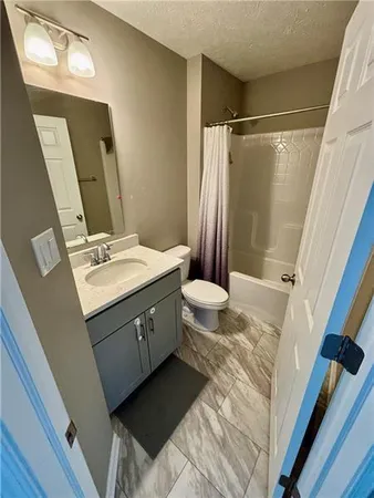 a bathroom with a sink a mirror and a shower