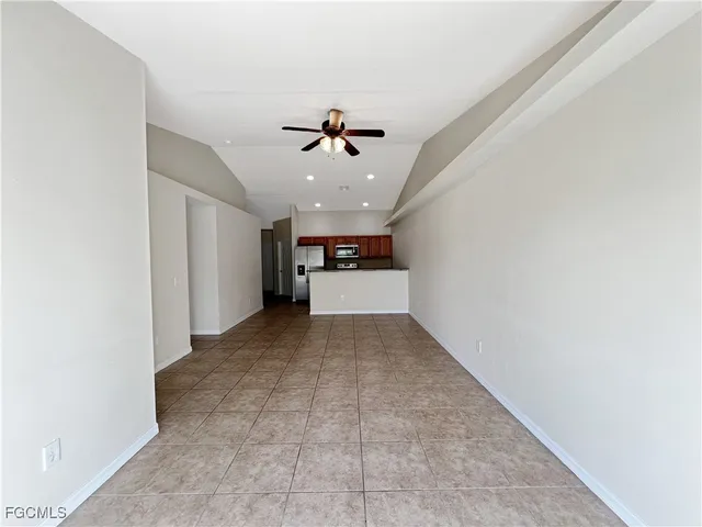 a view of a big room with closet and windows
