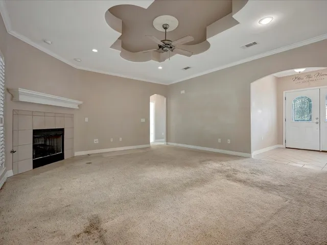 a view of an empty room with a fireplace