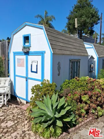a view of a chairs and tables in a patio