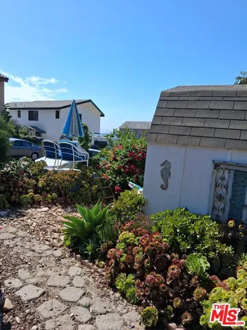 a view of a chairs and table in the patio