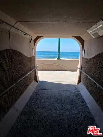 a view of a patio with table and chairs potted plants