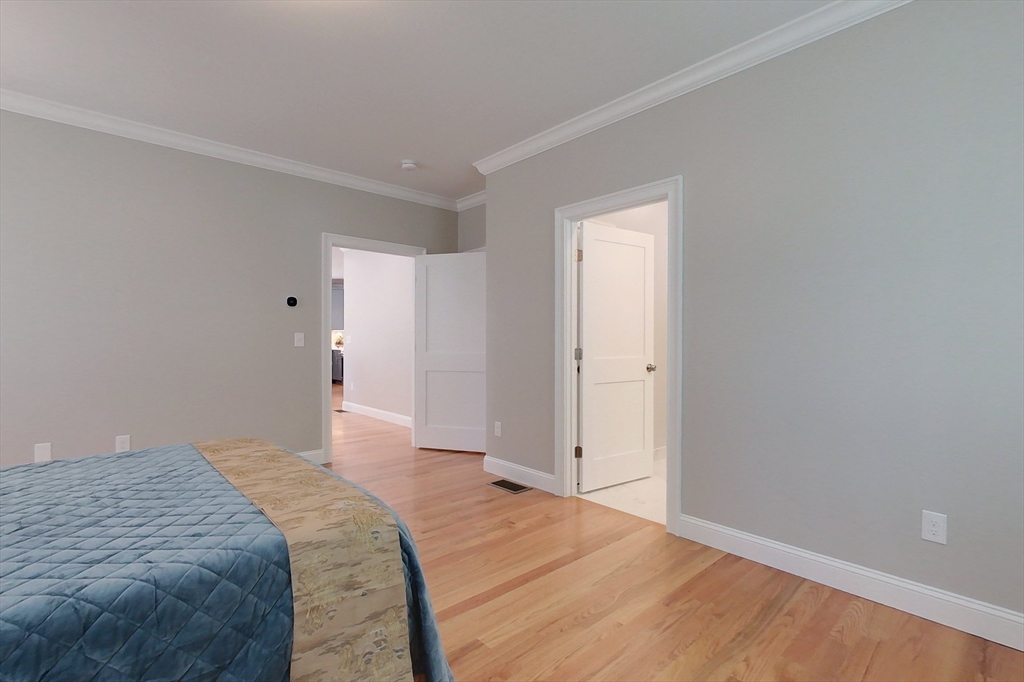 531 Clark Street Gardner, MA 01440 - Photo 16 of 42 a bedroom with a bed and wooden floor