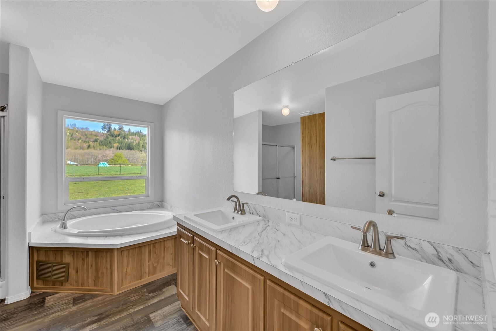 228 Mossyrock Road West Mossyrock, WA 98564 - Photo 12 of 27 a bathroom with a sink a mirror and a bathtub
