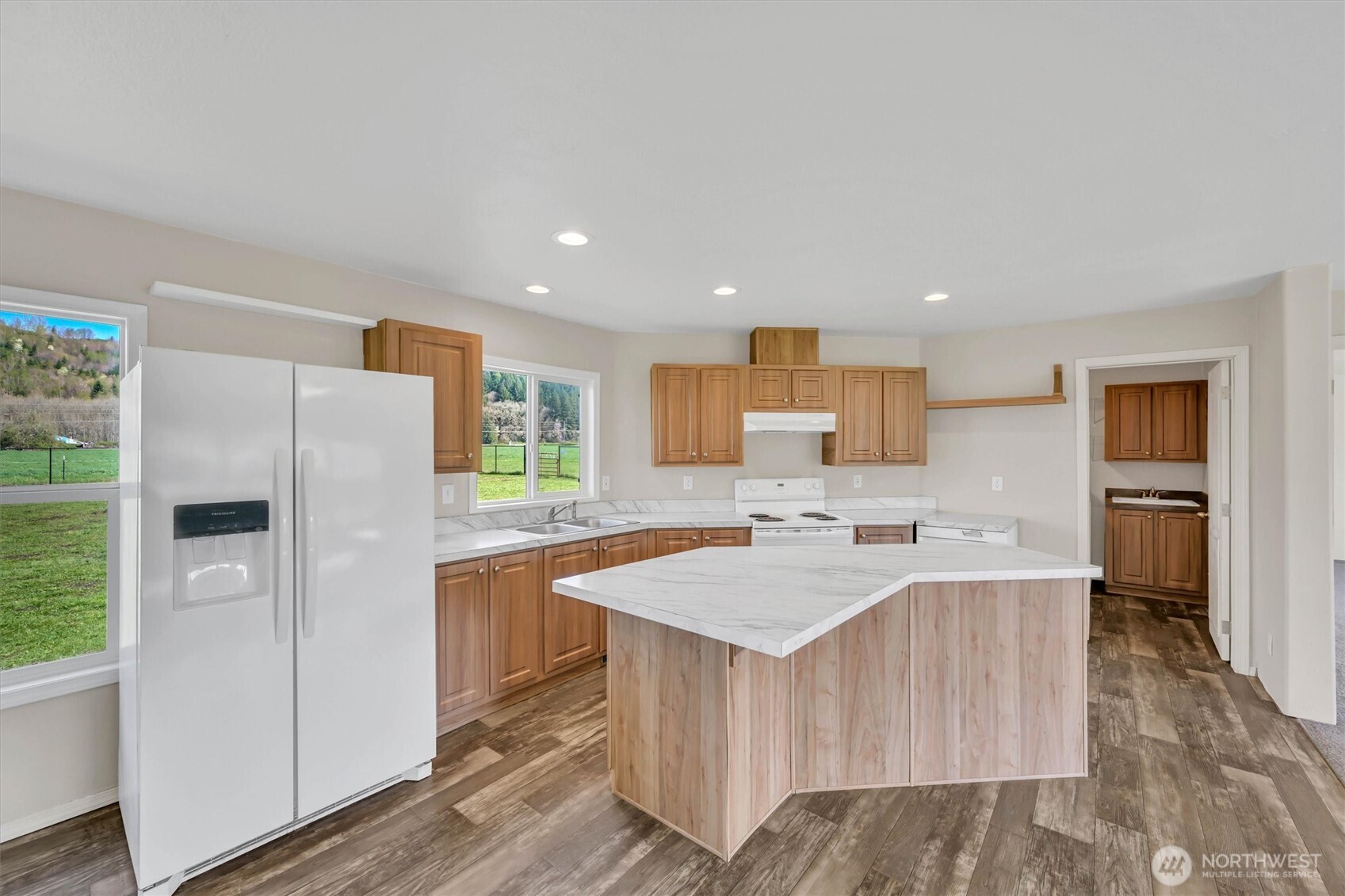 228 Mossyrock Road West Mossyrock, WA 98564 - Photo 7 of 27 a kitchen with refrigerator and cabinets