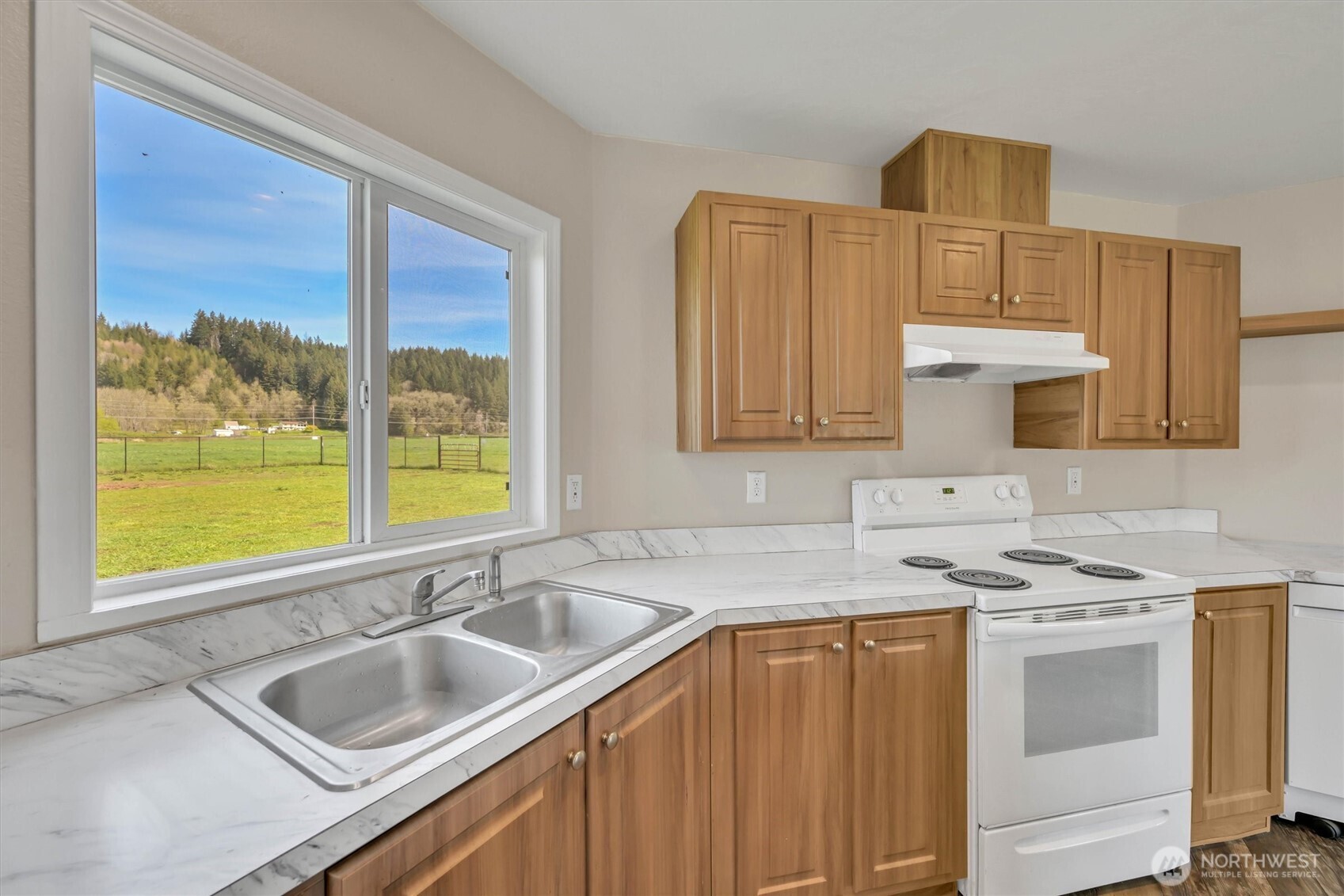 228 Mossyrock Road West Mossyrock, WA 98564 - Photo 9 of 27 a kitchen with stainless steel appliances a sink stove and cabinets
