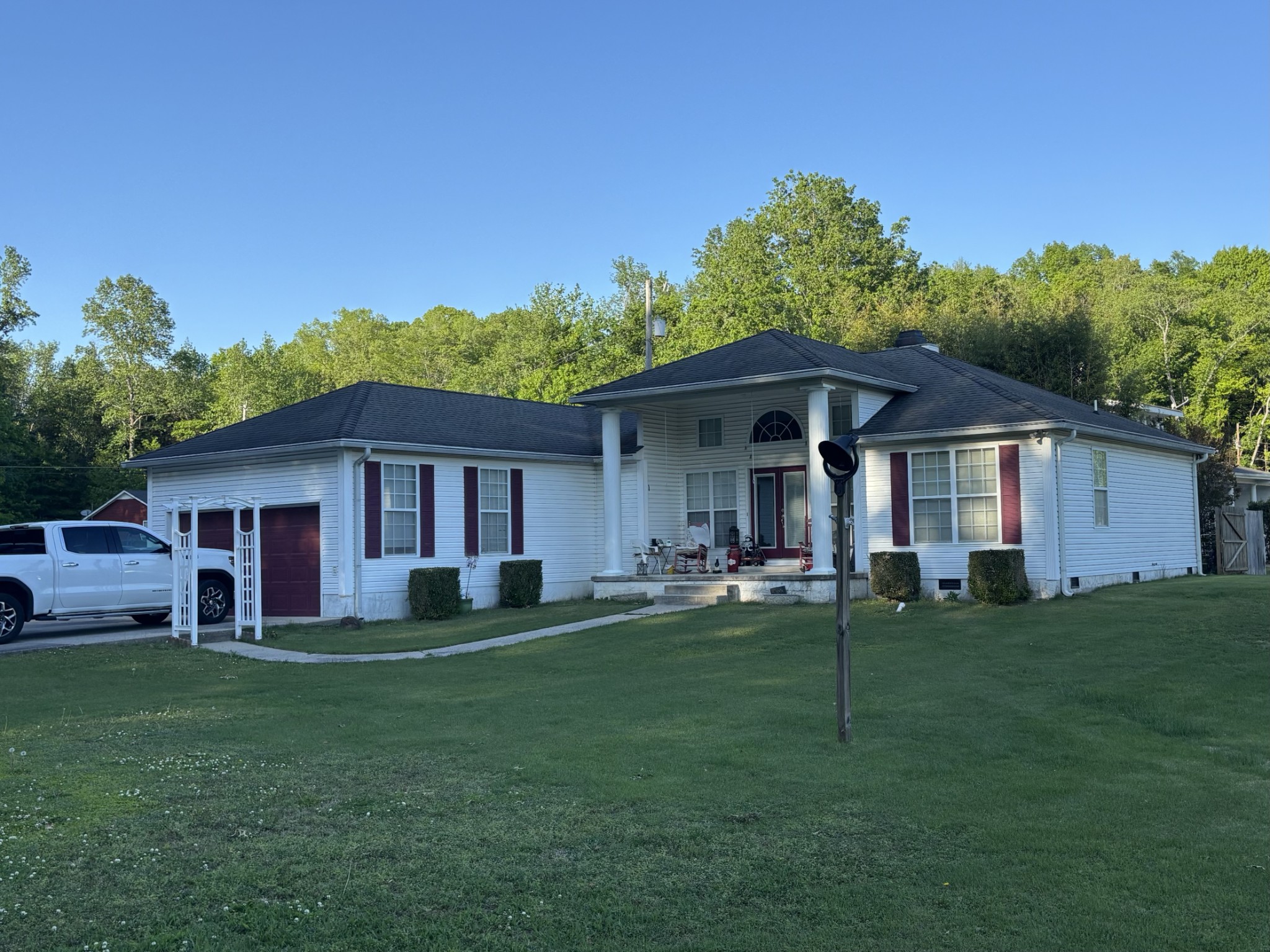 a front view of a house with a yard