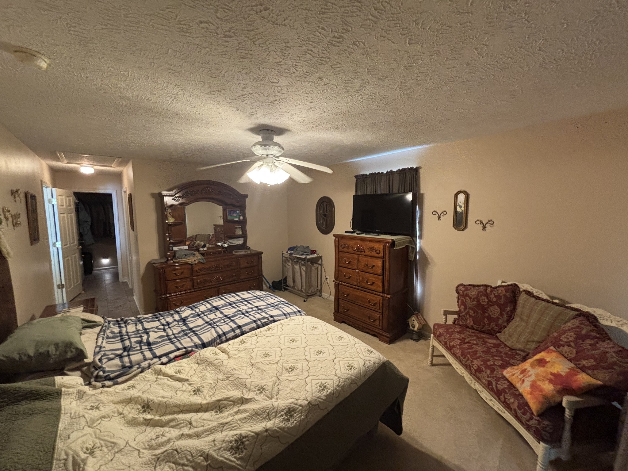 206 Dreaden Street Waverly, TN 37185 - Photo 15 of 26 a large bedroom with a bed and a view of kitchen