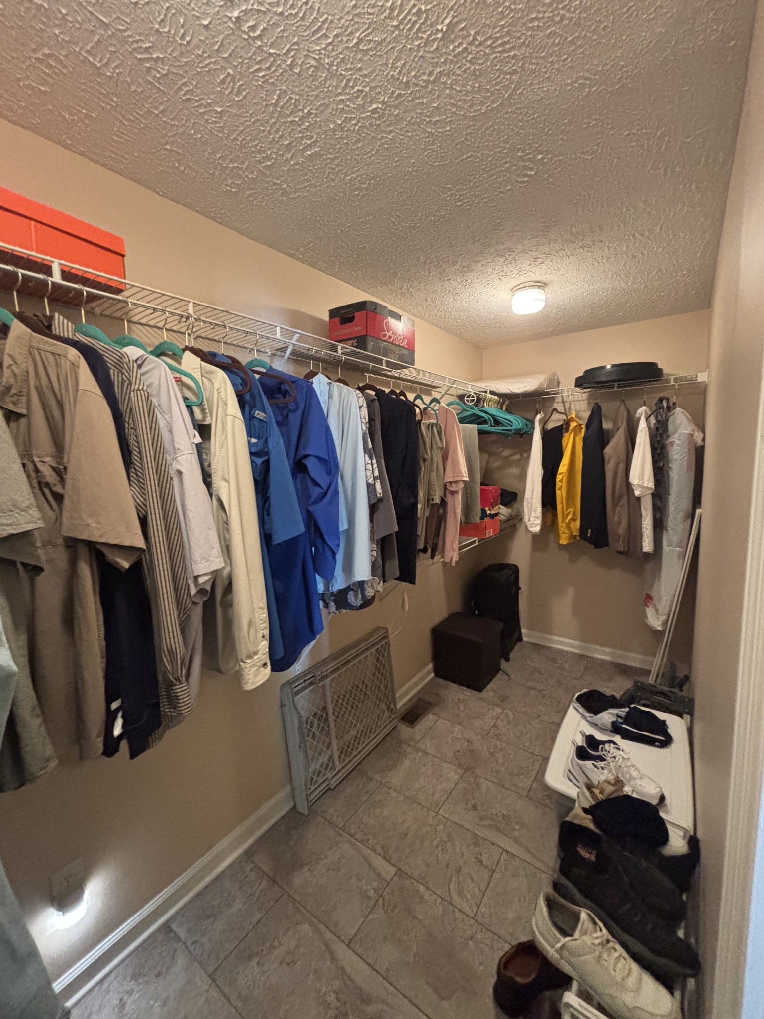 206 Dreaden Street Waverly, TN 37185 - Photo 16 of 26 a view of walk in closet with clothes and shoes