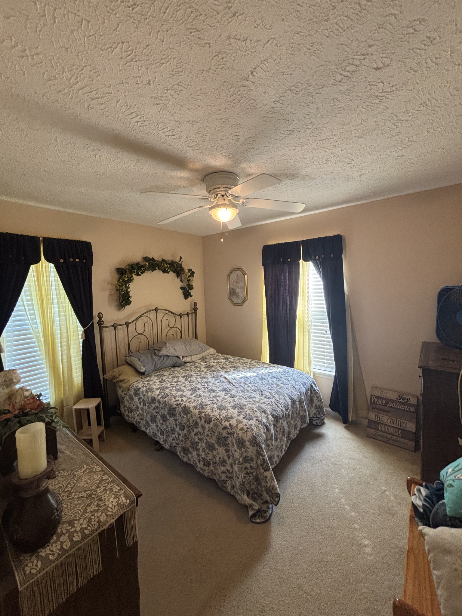 206 Dreaden Street Waverly, TN 37185 - Photo 18 of 26 a bedroom with a bed and dresser with mirror