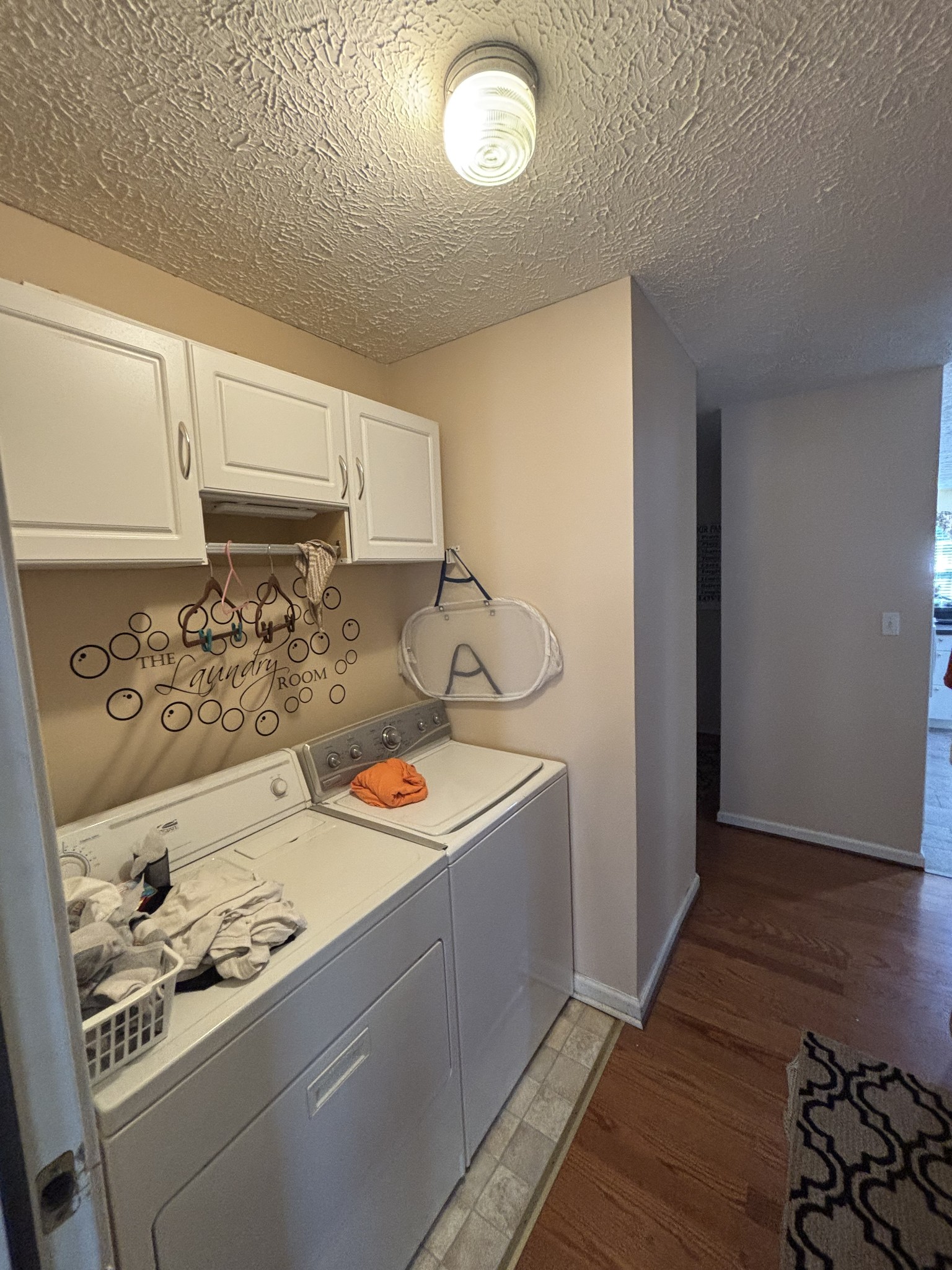 206 Dreaden Street Waverly, TN 37185 - Photo 22 of 26 a kitchen with stainless steel appliances granite countertop a sink and wooden cabinets