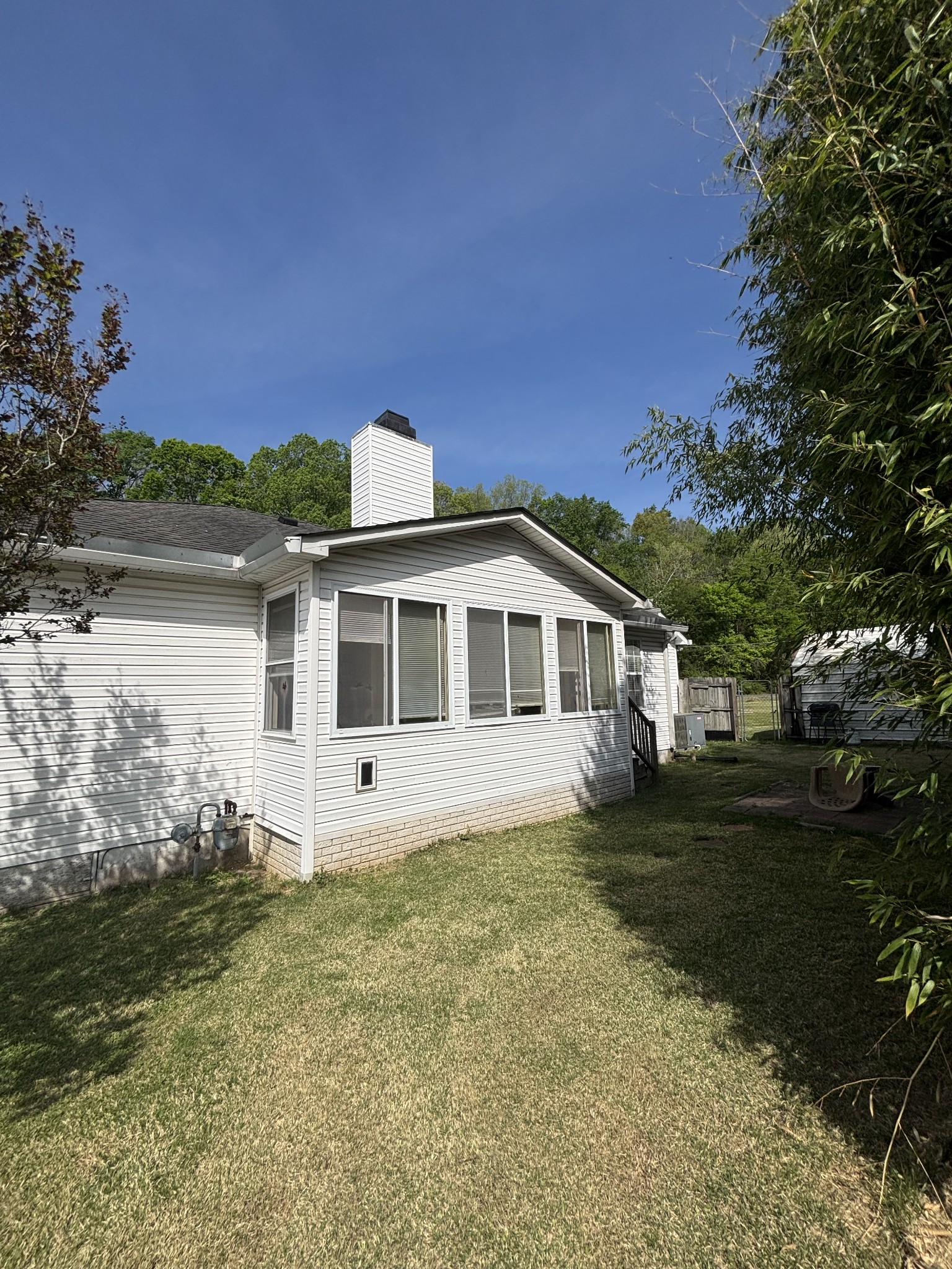 206 Dreaden Street Waverly, TN 37185 - Photo 24 of 26 a front view of a house with garden