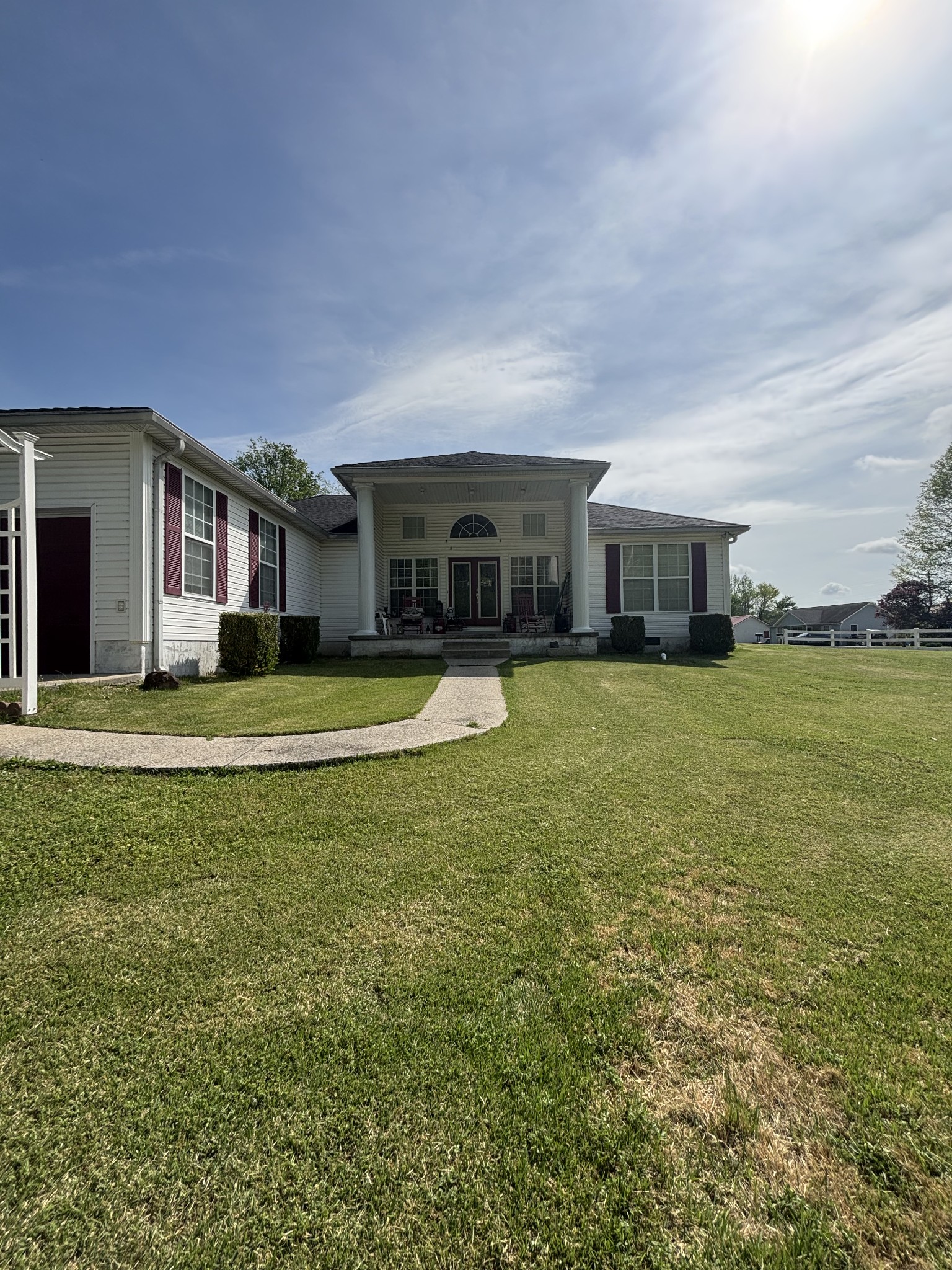 206 Dreaden Street Waverly, TN 37185 - Photo 3 of 26 a view of a house with a big yard and palm trees