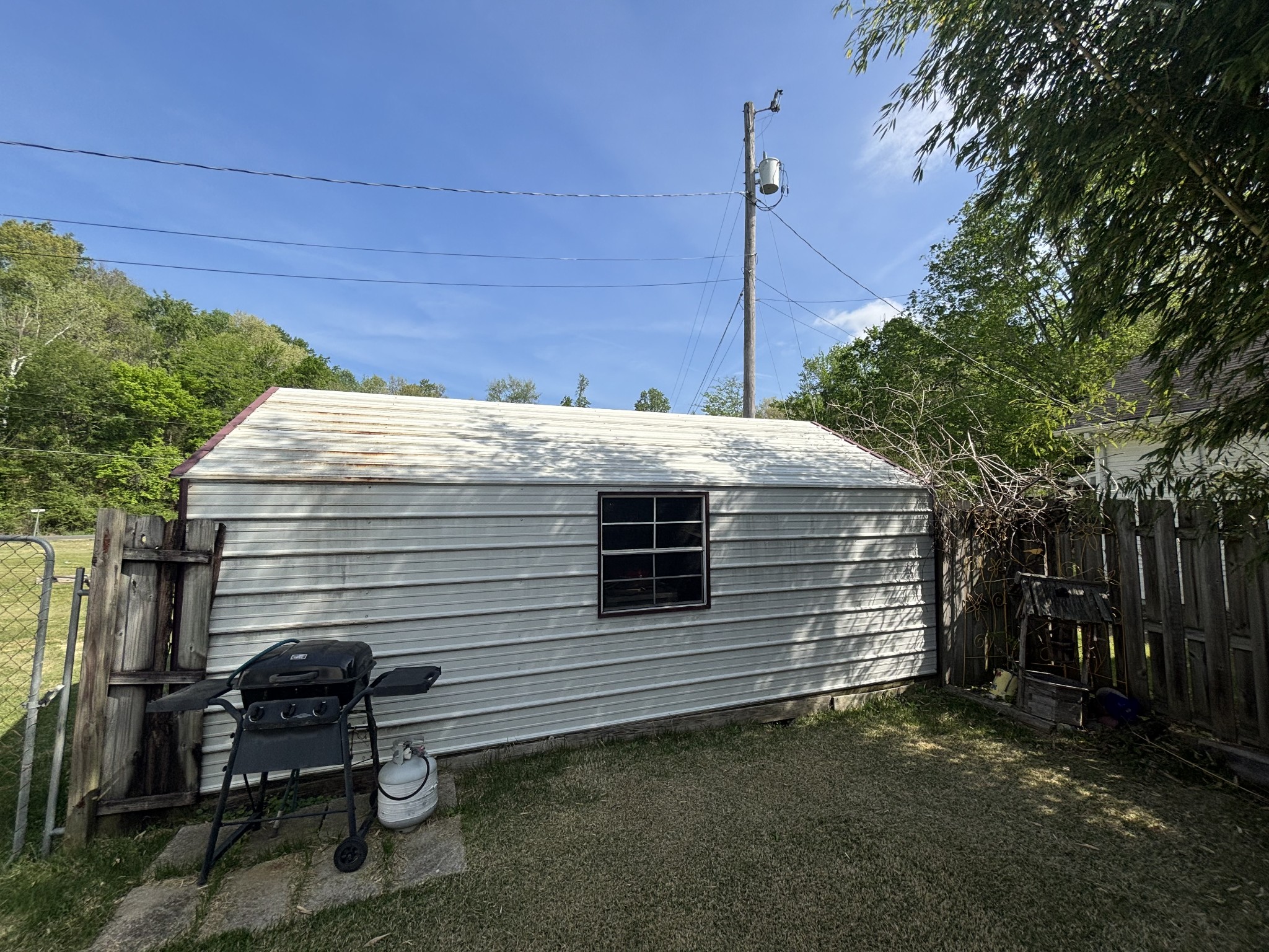 206 Dreaden Street Waverly, TN 37185 - Photo 6 of 26 a front view of a house with a garden