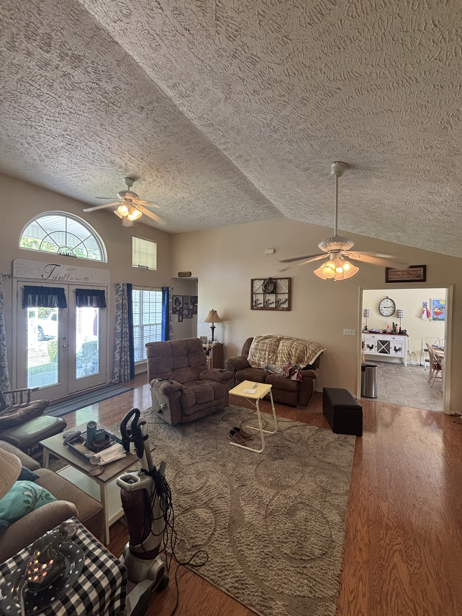 206 Dreaden Street Waverly, TN 37185 - Photo 7 of 26 a living room with furniture and a chandelier