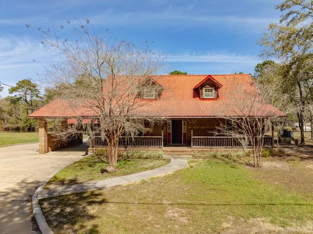 a view of a swimming pool with an outdoor seating