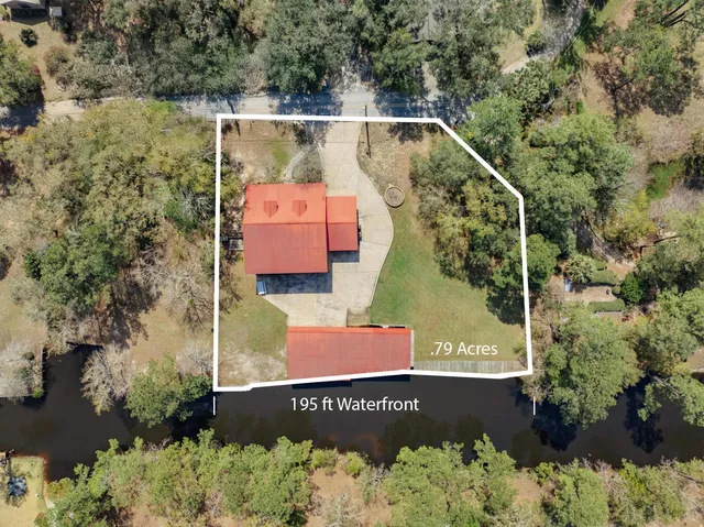 an aerial view of a house with a garden