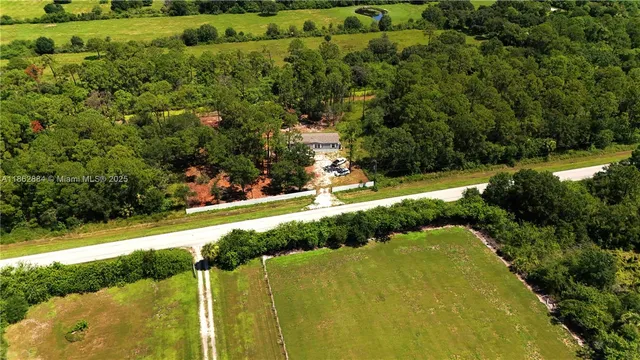 a view of a street with a yard
