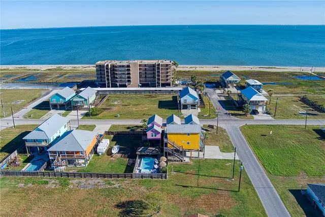 an aerial view of a house with a swimming pool