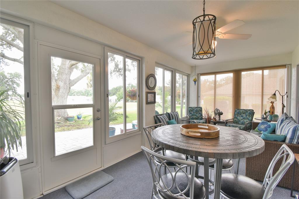 5366 Northwest 21st Loop Ocala, FL 34482 - Photo 19 of 36 a view of a dining room with furniture window and outside view