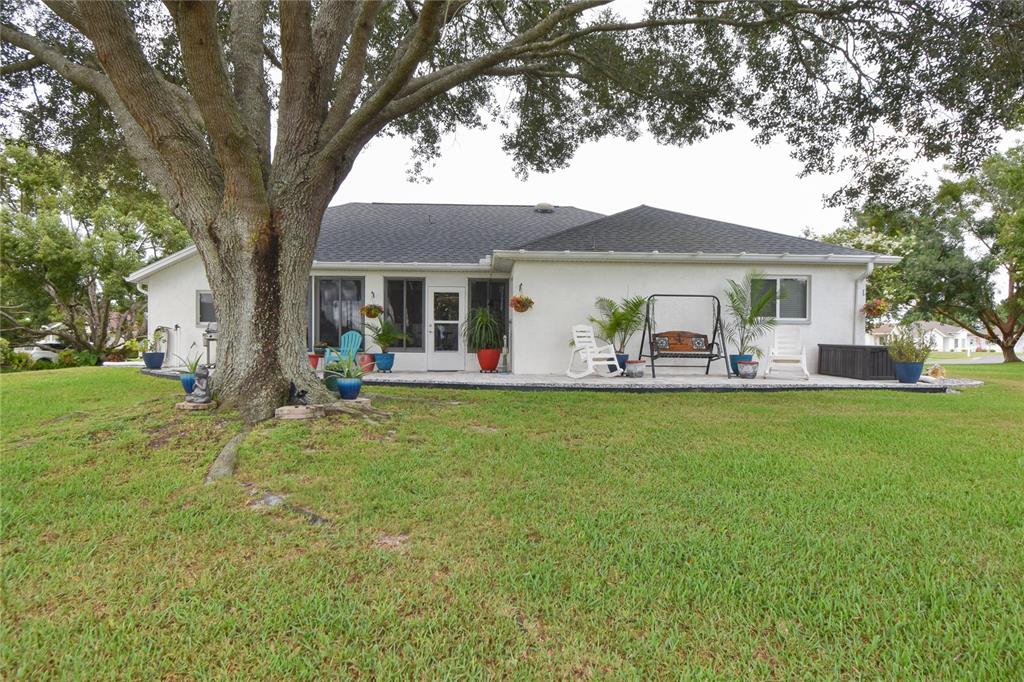 5366 Northwest 21st Loop Ocala, FL 34482 - Photo 22 of 36 a front view of house with yard and outdoor seating