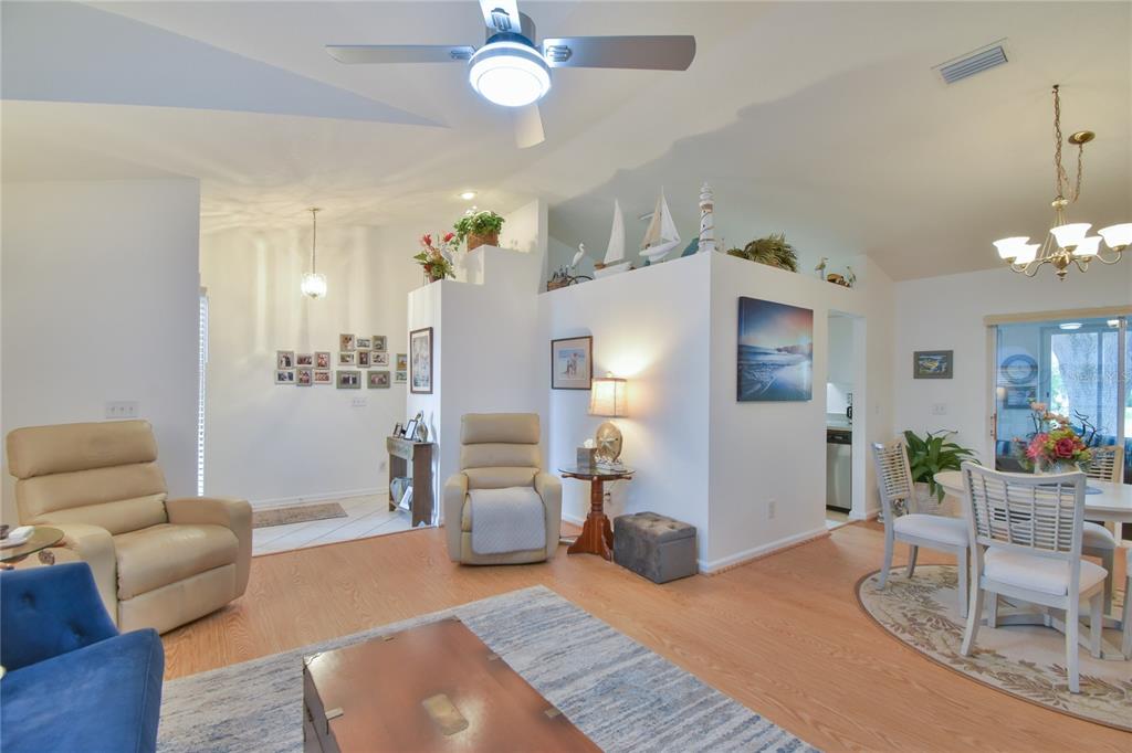 5366 Northwest 21st Loop Ocala, FL 34482 - Photo 5 of 36 a living room with furniture and wooden floor