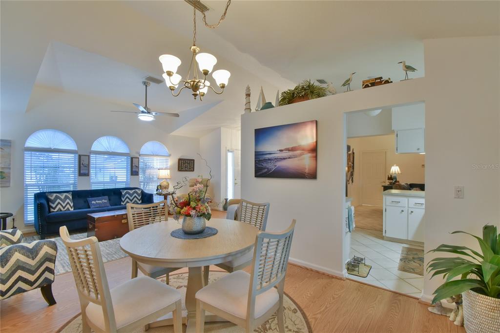 5366 Northwest 21st Loop Ocala, FL 34482 - Photo 6 of 36 a view of a dining room with furniture and a chandelier