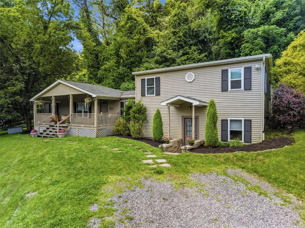 8517 Wittmer Road Pittsburgh, PA 15237 - Photo 43 of 46 a front view of a house with a yard