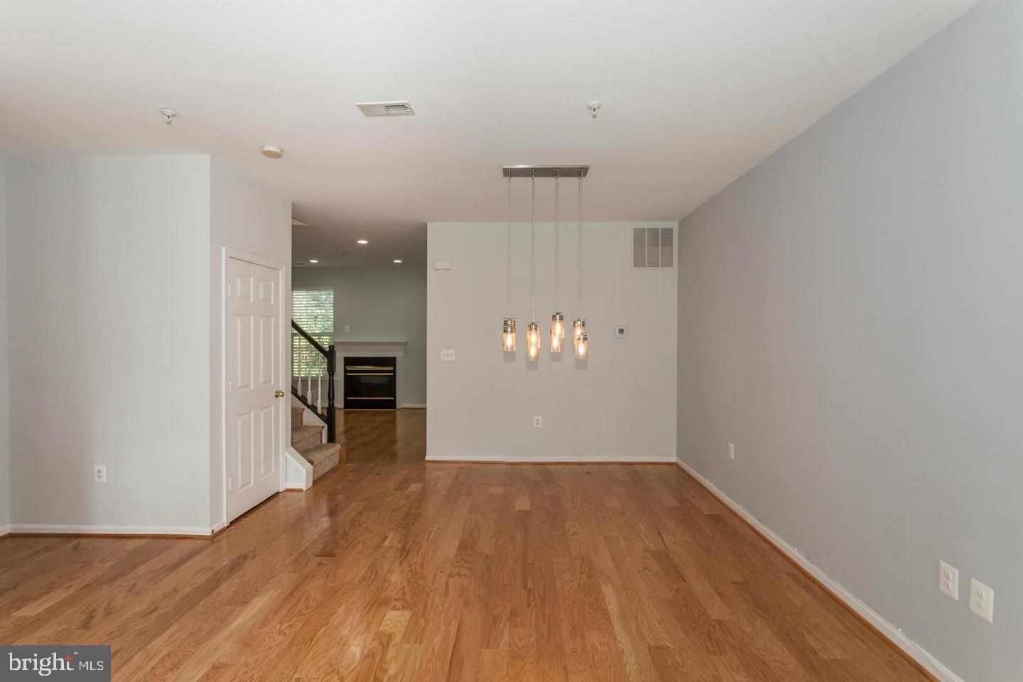 Open Dining Room with Upgraded Light Fixture