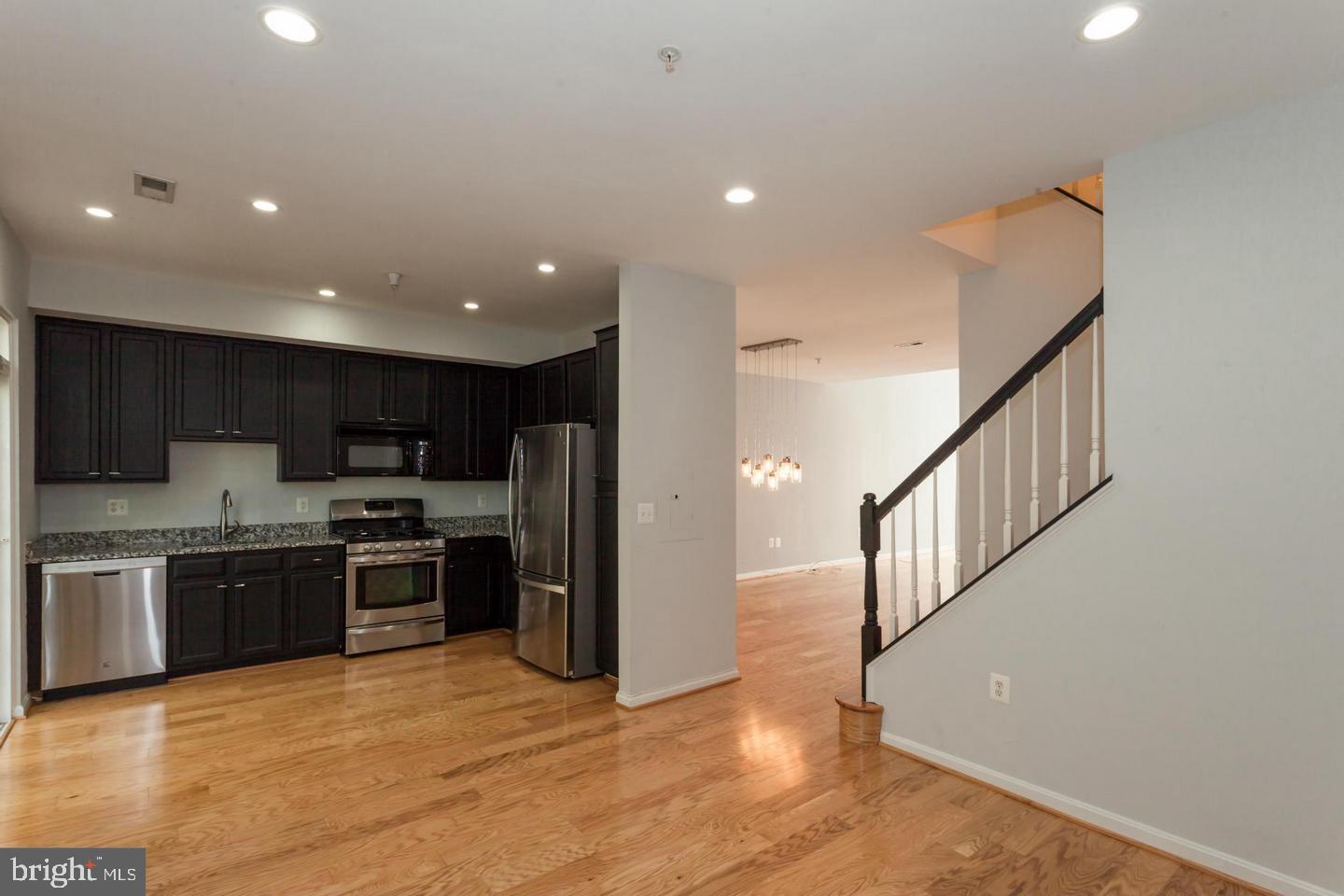 11401 Gate Hill Place, Unit 72 Reston, VA 20194 - Photo 8 of 30 View from Family Room into Kitchen