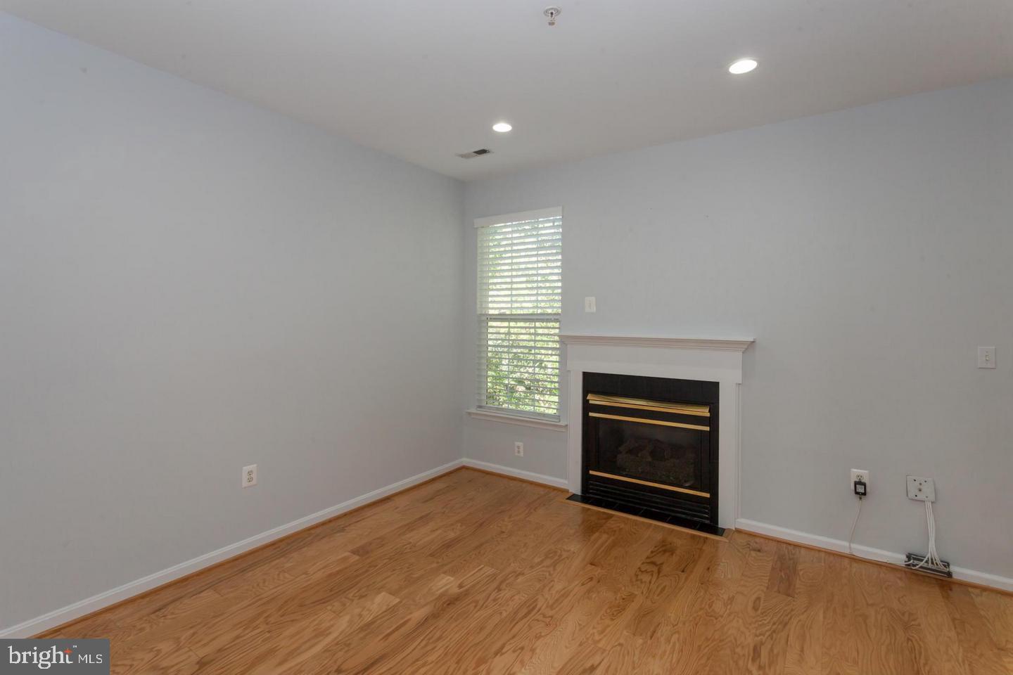 11401 Gate Hill Place, Unit 72 Reston, VA 20194 - Photo 9 of 30 Gas Fireplace in Family Room