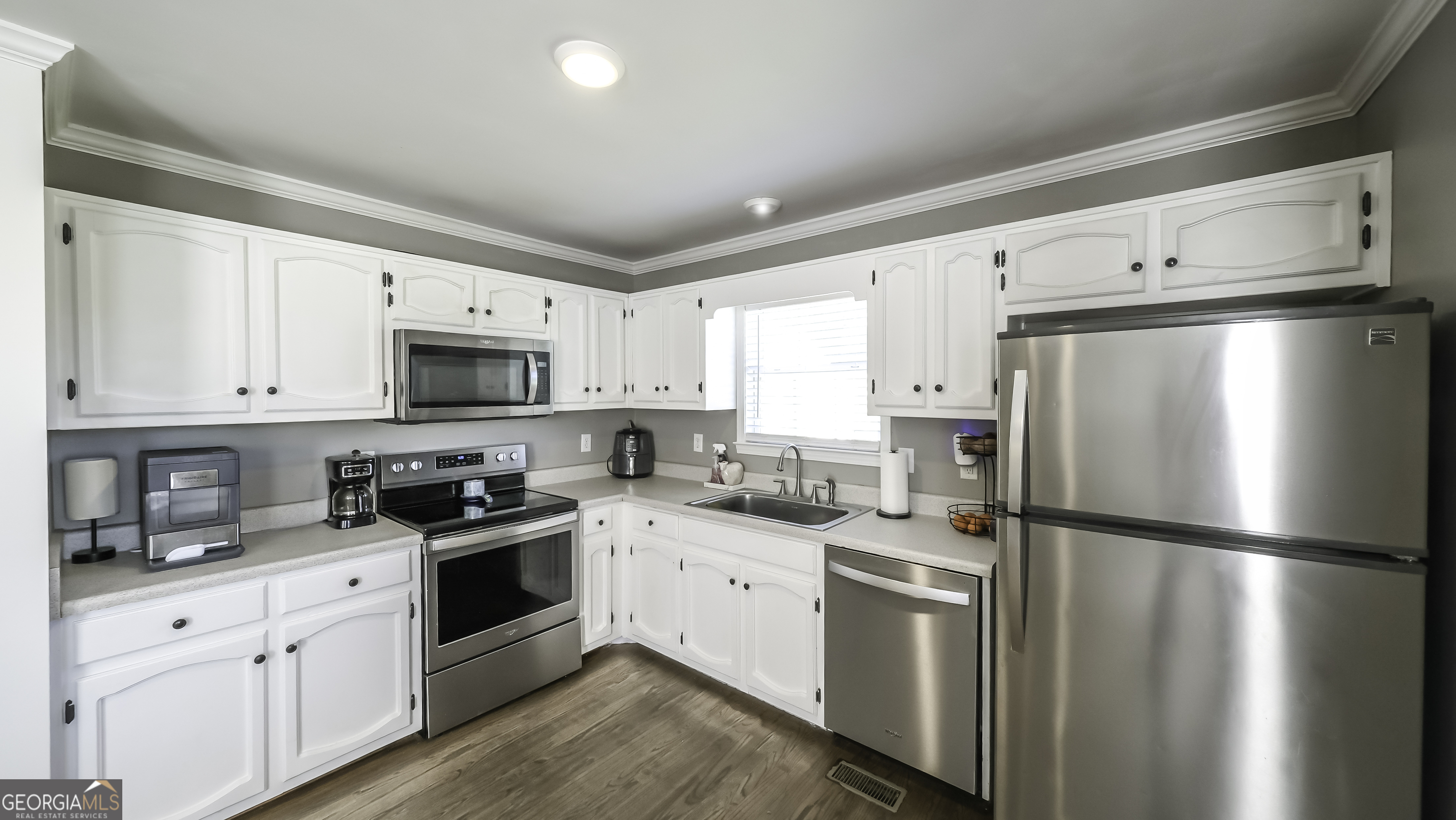 505 Miranda Way Temple, GA 30179 - Photo 15 of 33 a kitchen with stainless steel appliances a refrigerator stove and white cabinets