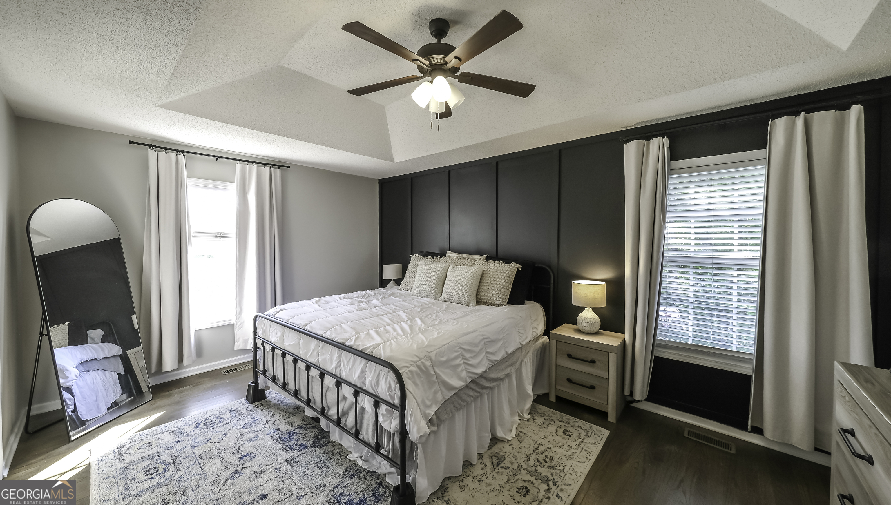 505 Miranda Way Temple, GA 30179 - Photo 18 of 33 a bedroom with a bed next to a window with a chandelier