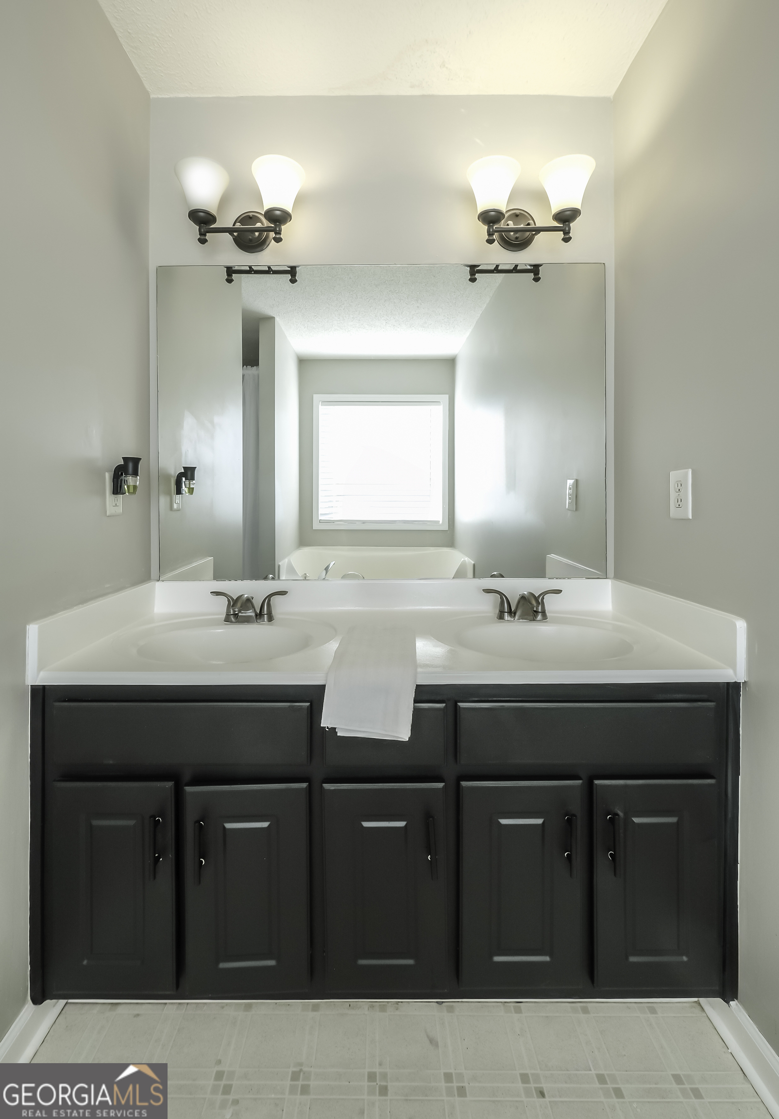 505 Miranda Way Temple, GA 30179 - Photo 21 of 33 a bathroom with a sink double vanity and a mirror