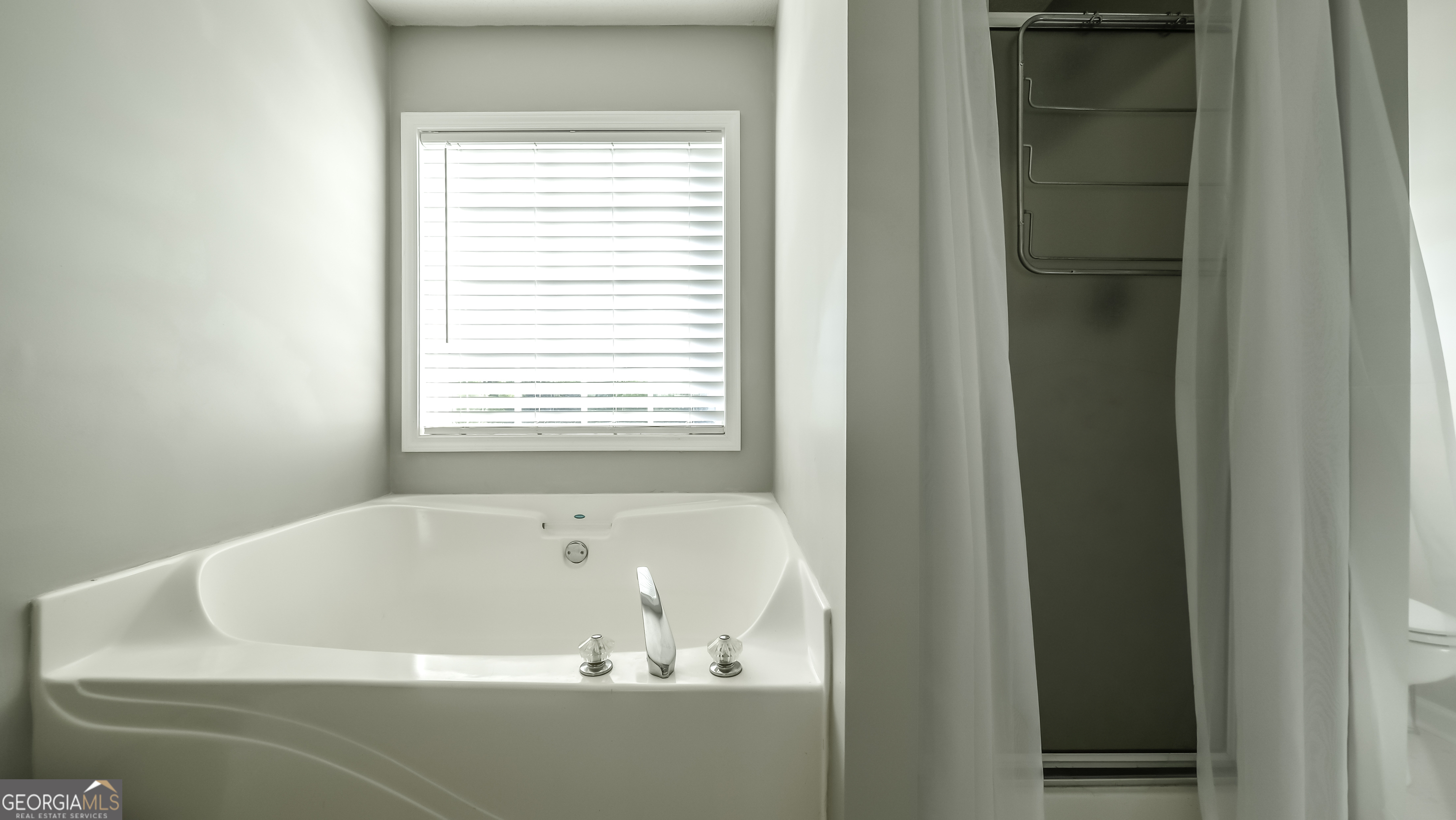 505 Miranda Way Temple, GA 30179 - Photo 23 of 33 a white bath tub sitting next to a window