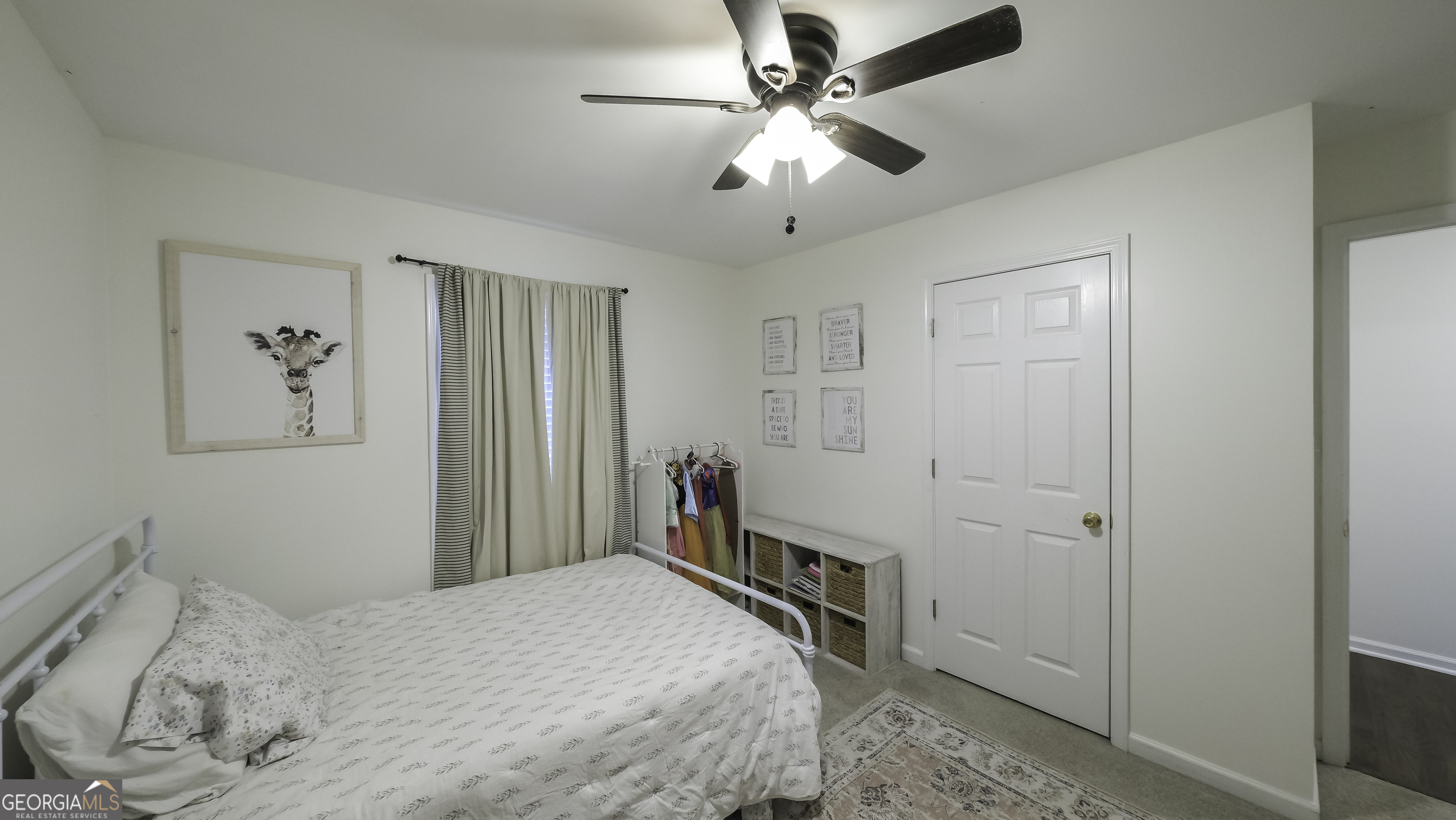 505 Miranda Way Temple, GA 30179 - Photo 25 of 33 a bedroom with a bed and a chandelier