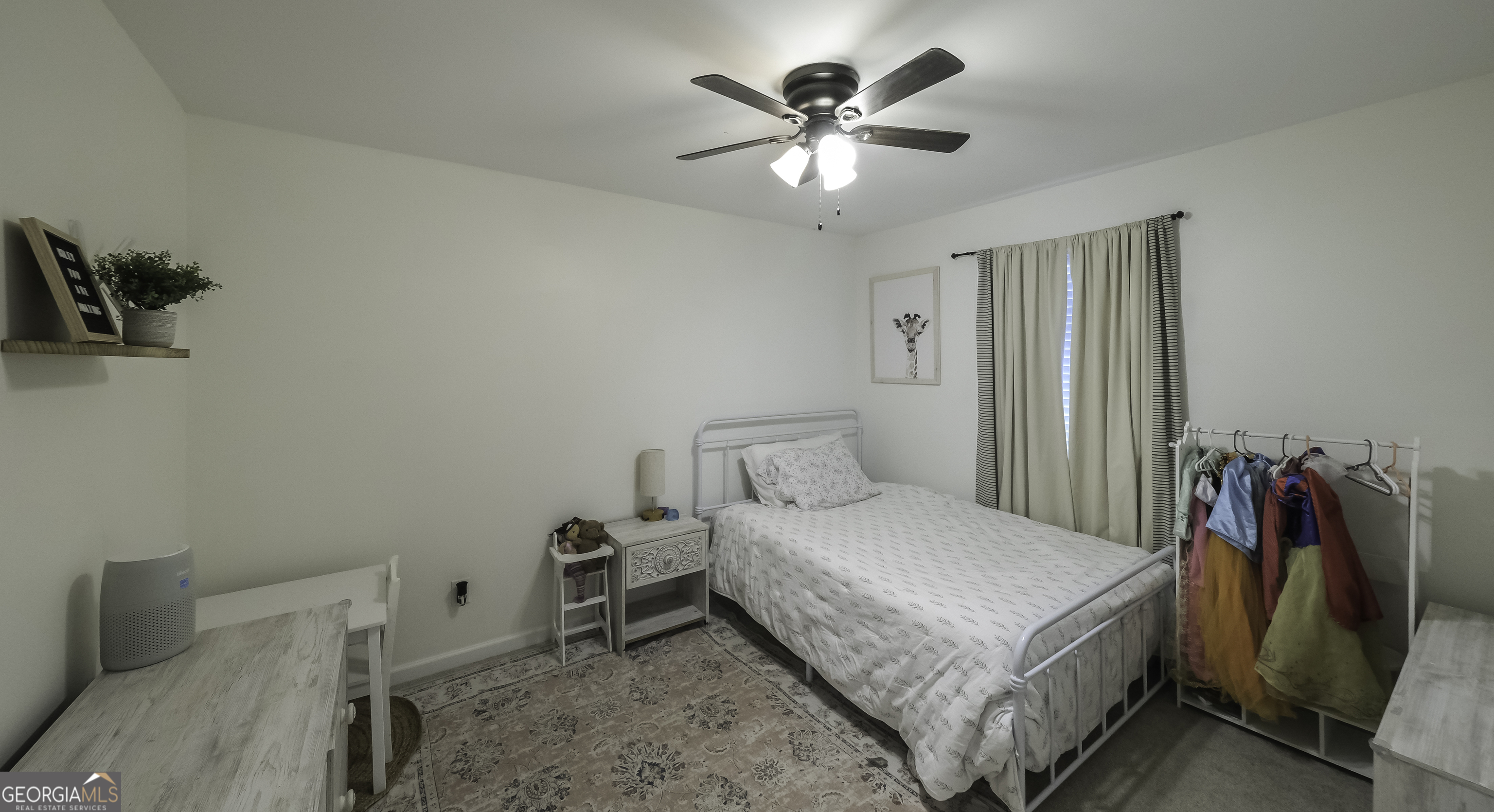 505 Miranda Way Temple, GA 30179 - Photo 26 of 33 a bedroom with a bed and a chandelier