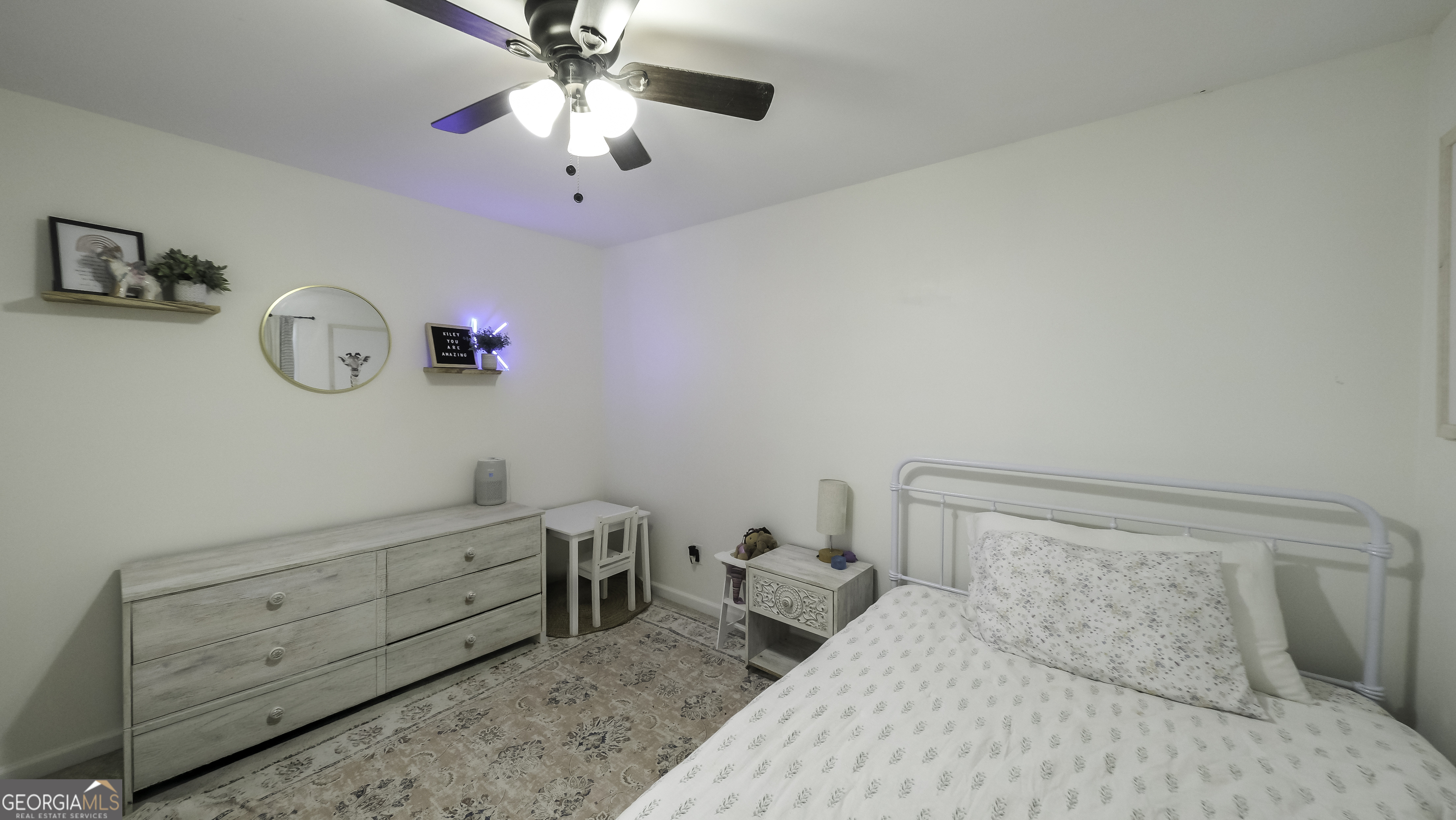505 Miranda Way Temple, GA 30179 - Photo 27 of 33 a bedroom with a bed and a chandelier fan