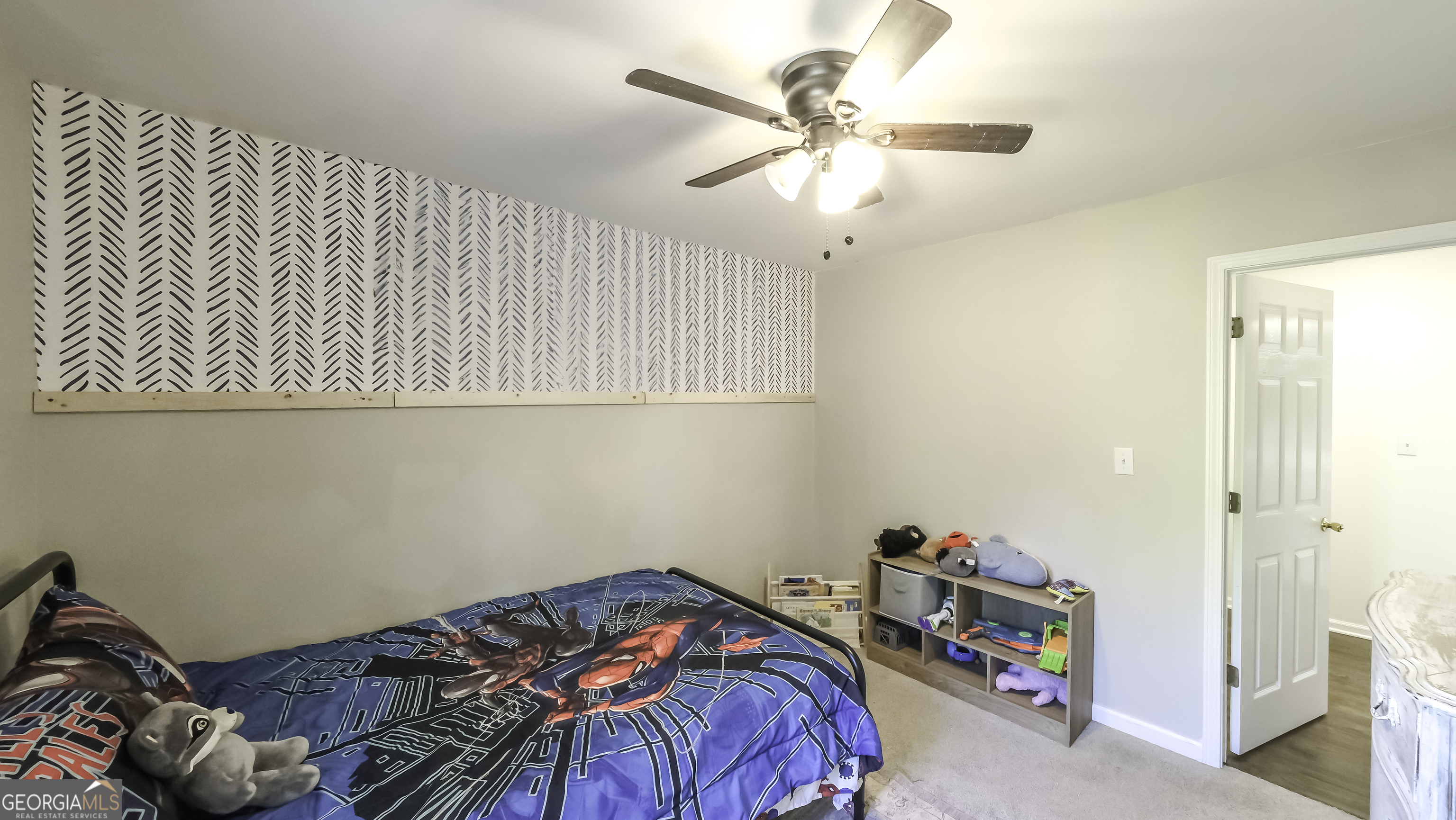 505 Miranda Way Temple, GA 30179 - Photo 28 of 33 a bedroom with a bed and a chandelier