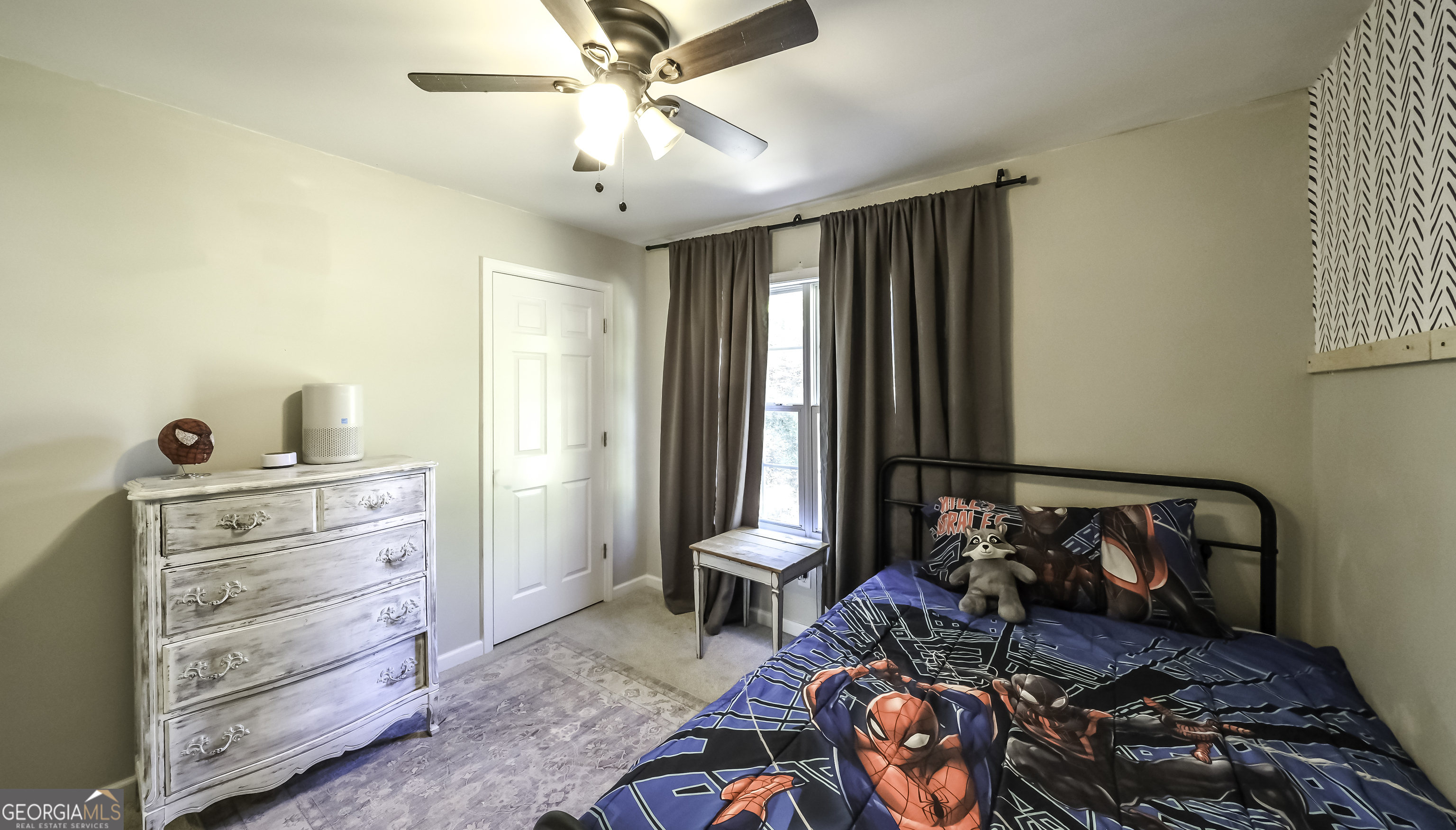 505 Miranda Way Temple, GA 30179 - Photo 29 of 33 a bedroom with a bed and a chandelier