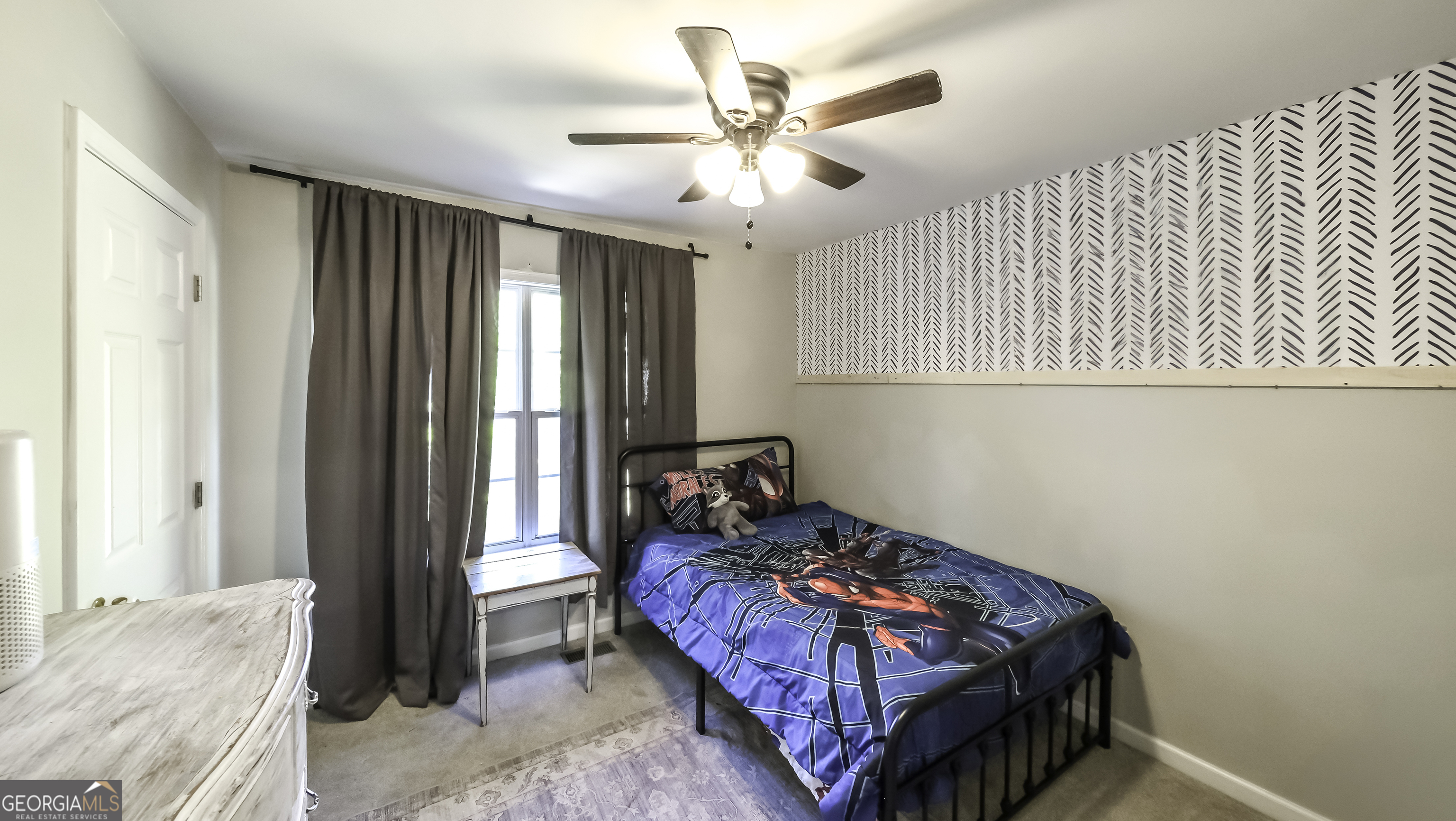 505 Miranda Way Temple, GA 30179 - Photo 30 of 33 a bedroom with a bed and a chandelier