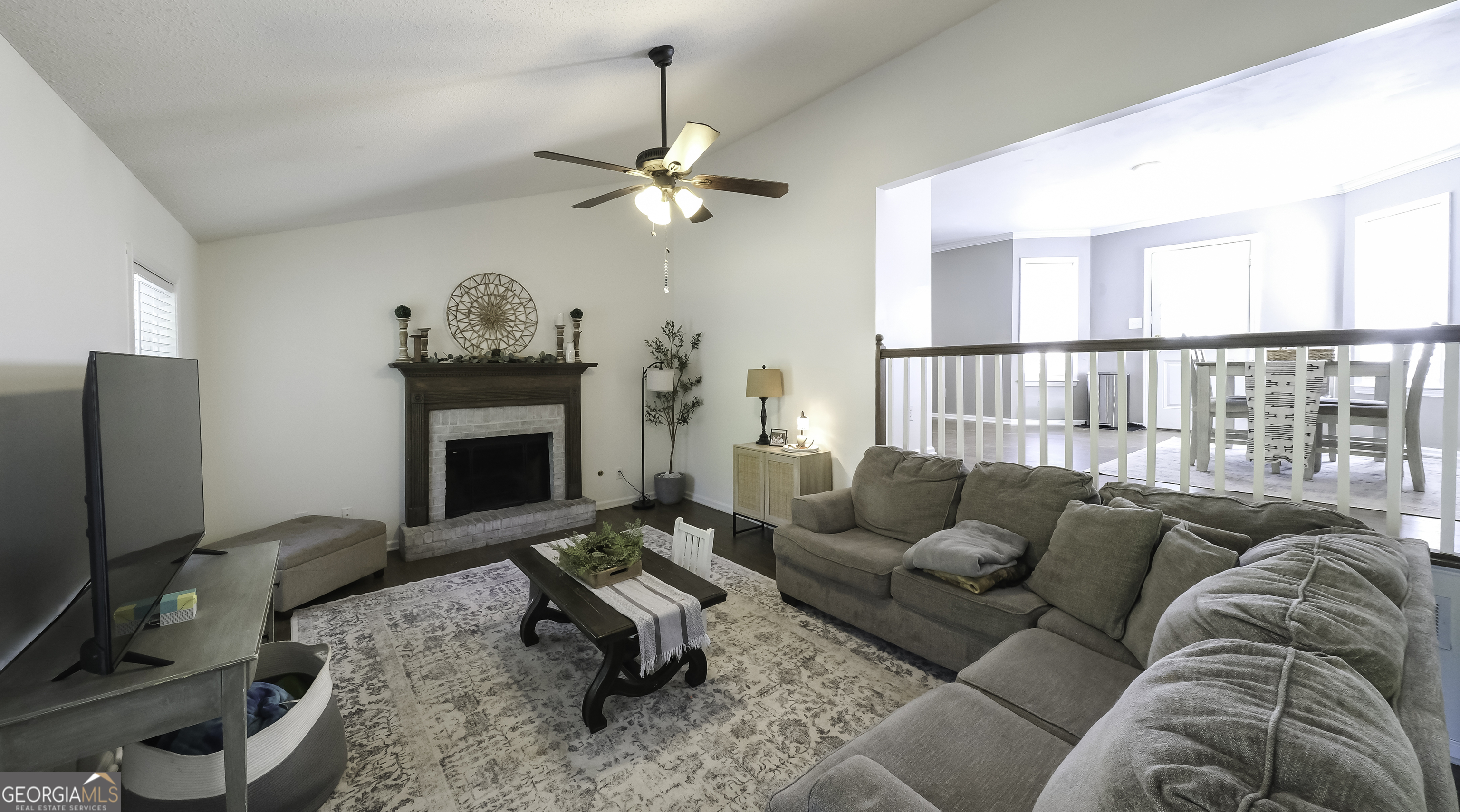 505 Miranda Way Temple, GA 30179 - Photo 10 of 33 a living room with furniture a fireplace and a flat screen tv